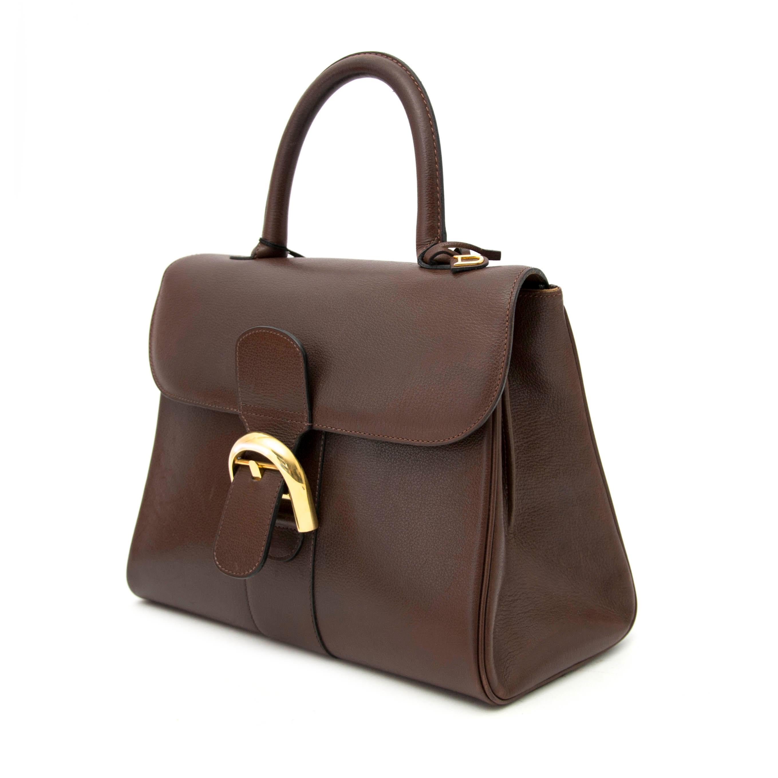 Good Preloved condition

Delvaux Brown Brillant MM + Strap

The iconic Delvaux Brillant MM + strap was designed in 1958 and is still very much on trend today.
This Delvaux Brillant comes in a medium size and is crafted out of brown grained