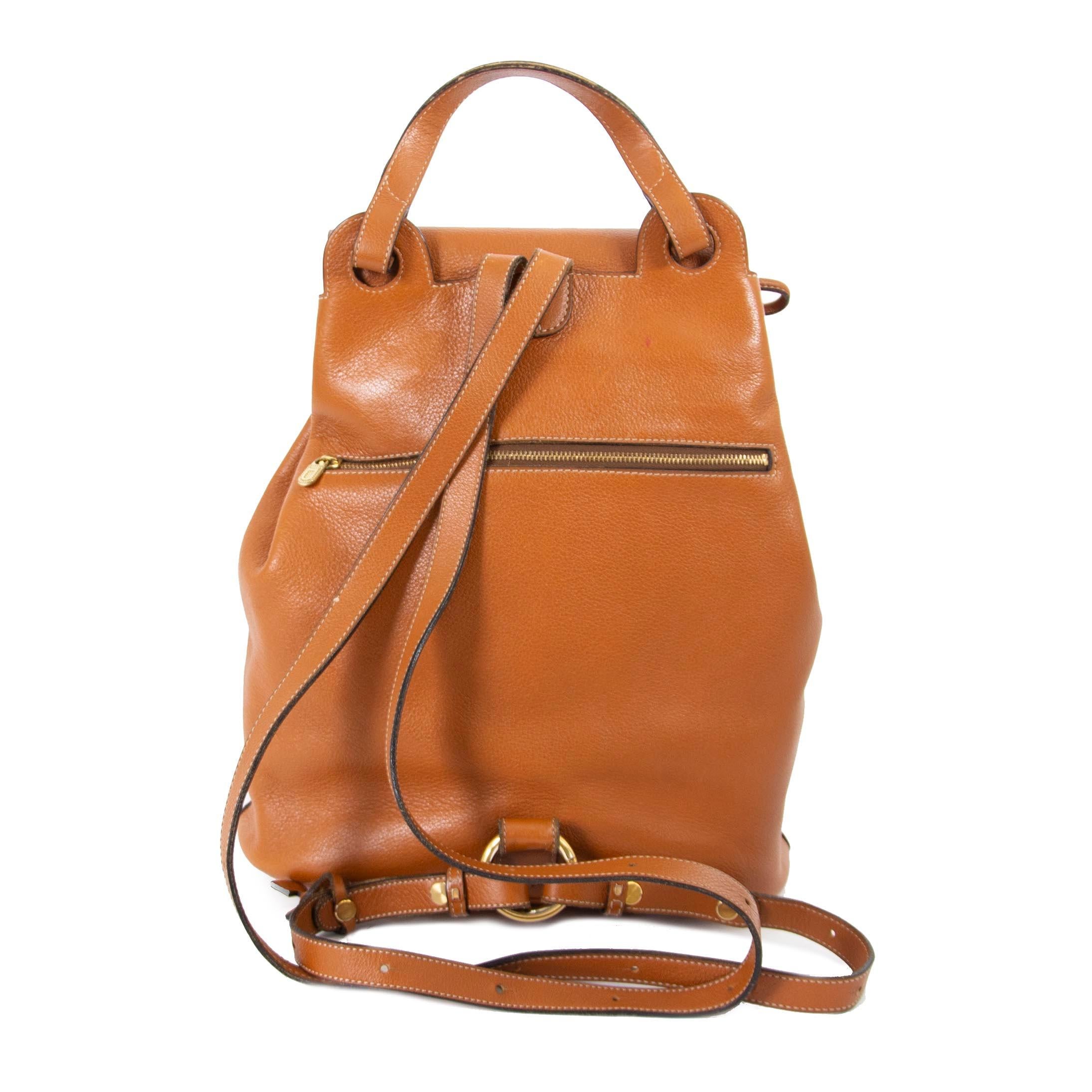 

Delvaux Camel Leather PM Backpack

This beautiful leather Delvaux backpack in a timeless camel color is a perfect everyday handbag.

With its gold hardware and spacious interior this backpack can fit all of your daily essentials.


