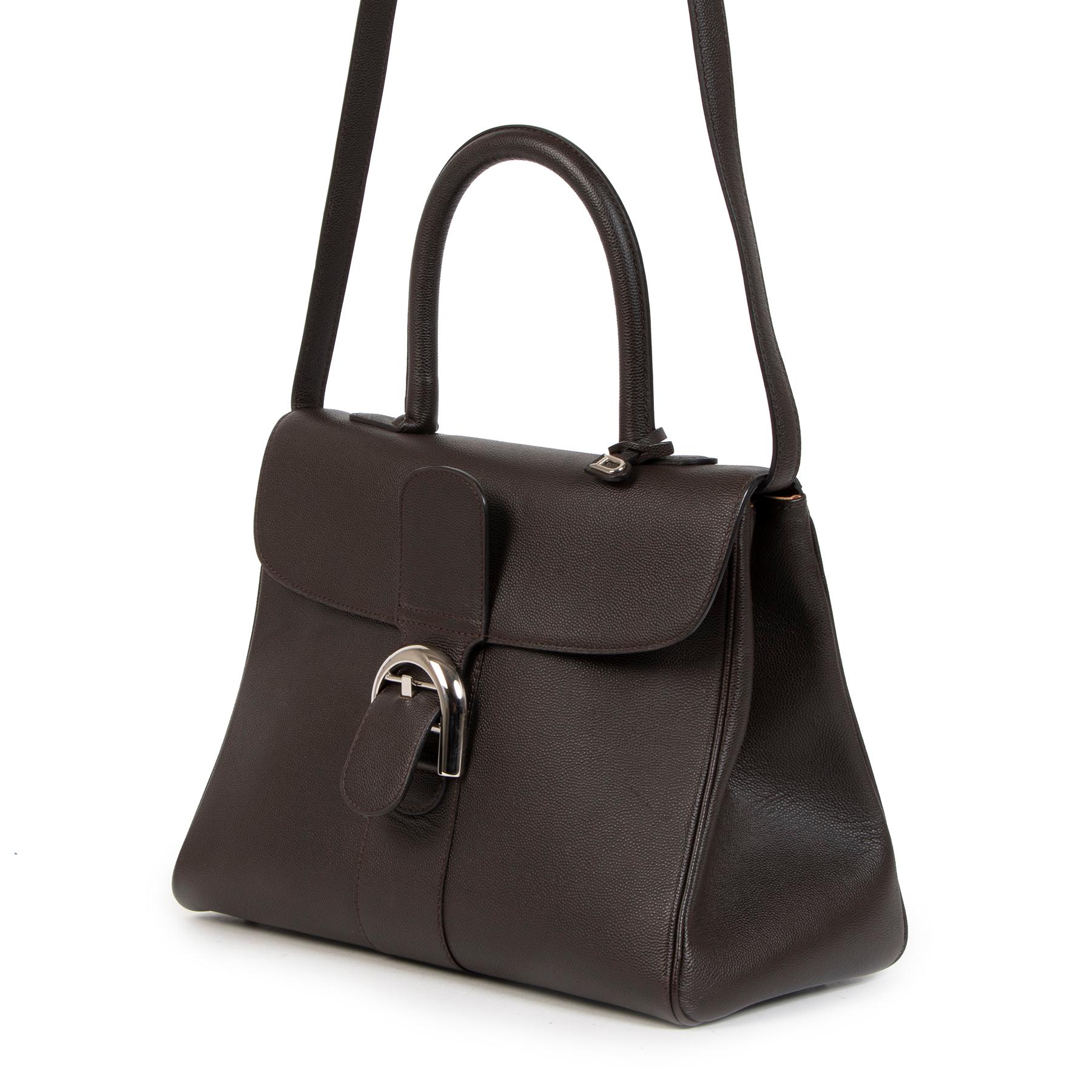 Excellent preloved condition

Delvaux Brillant Dark Grey MM

Introducing this timeless classic by Delvaux, the Brillant. Expertly crafted of dark grey, brown ebene leather and beautifully finished with iconic silver toned D buckle hardware. Wear