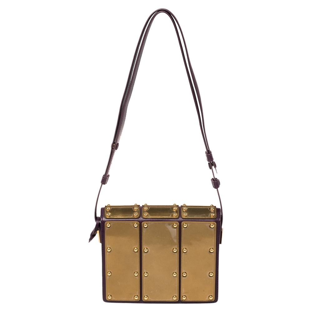 Every feature on this Delvaux bag is awe-evoking, making the creation worthy of being owned. It has been crafted from leather in France and styled with a flap that reveals a well-sized interior. The bag has a shoulder strap and an iron shield design