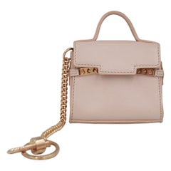 Delvaux nano handbag in baby pink leather.