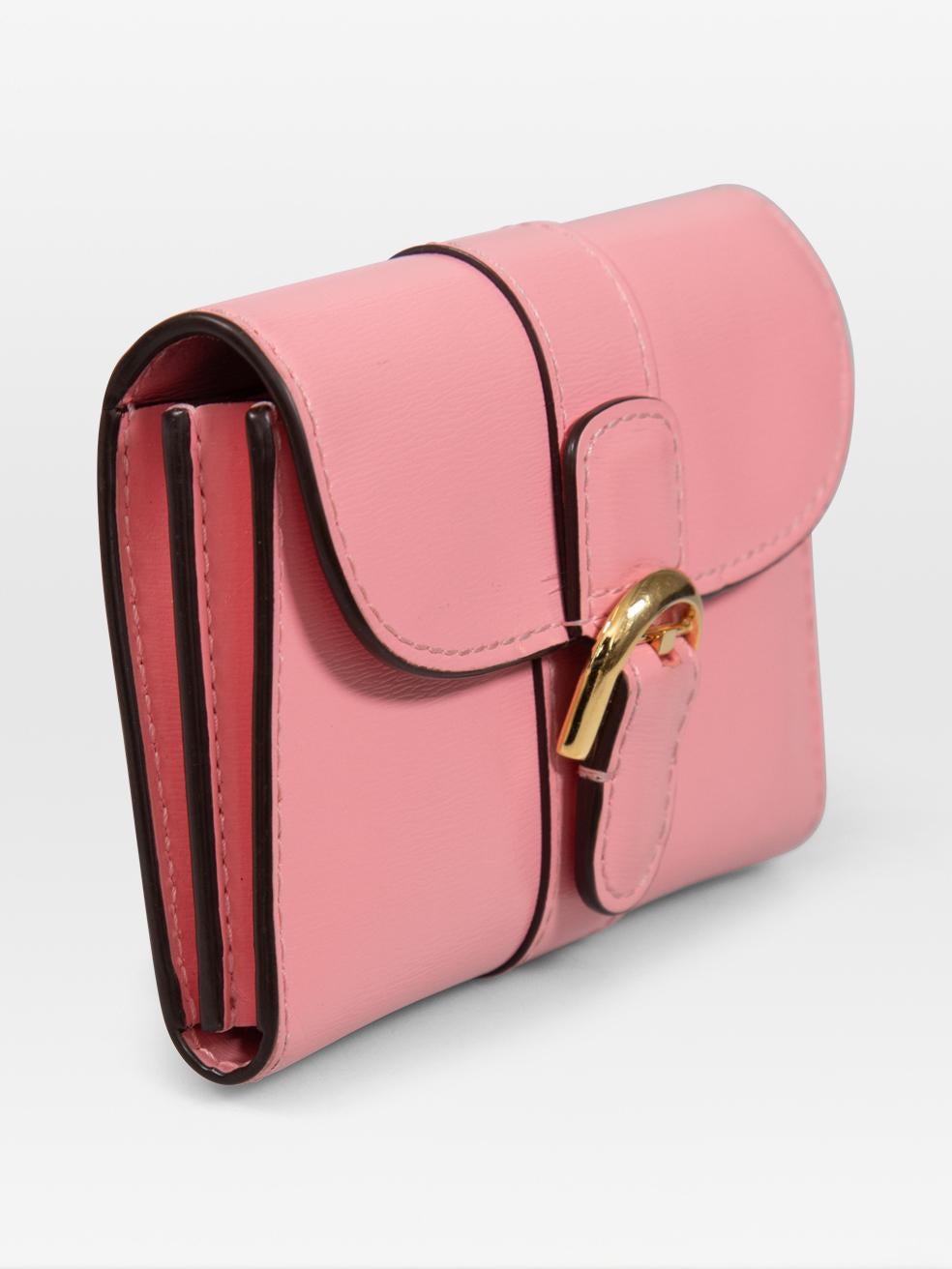 CONDITION is Very good. Minimal wear to the card holder is evident. Discolouration on the right corner. Abrasion on the front, base and back. Scratching to the centre front buckle detailing on this used Delvaux designer resale item.
 
 Details
 
 
