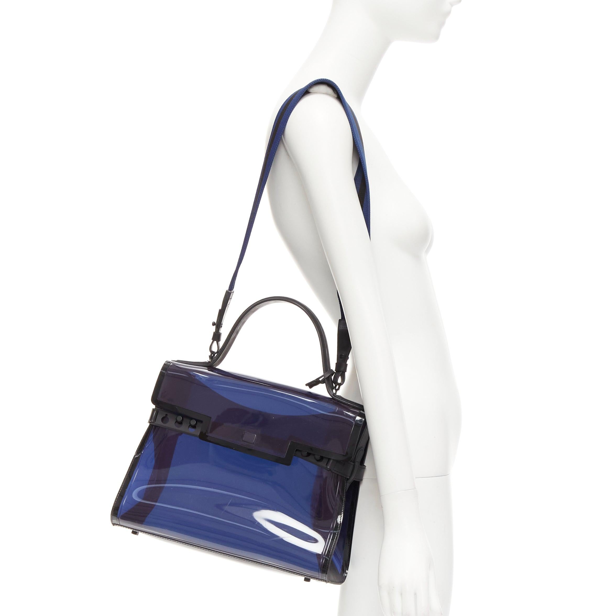 DELVAUX PVC Tempete Dark Night Bleu De Prusse navy flap satchel bag
Reference: EALU/A00034
Brand: Delvaux
Model: Tempete PVC
Material: PVC, Rubber, Fabric
Color: Navy, Black
Pattern: Solid
Closure: Push Clasp
Lining: Navy PVC
Extra Details: DELVAUX