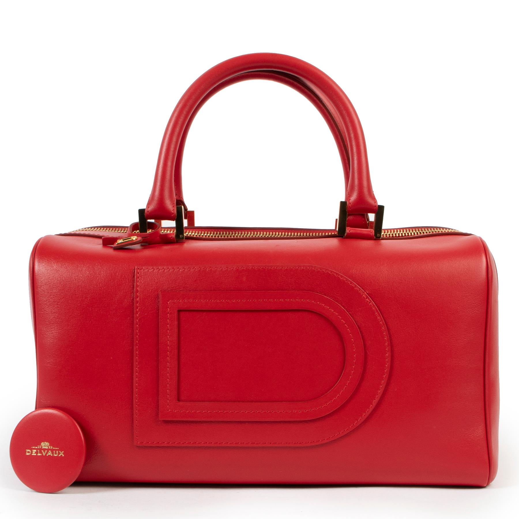 Delvaux Red Louise Boston Top Handle Bag

Crafted in Red leather and finished with gold-toned hardware, this Romantic Delvaux is a truly must-have! The interior is very spacious and has a zip- and patch pocket with an extra key holder. The bag has a