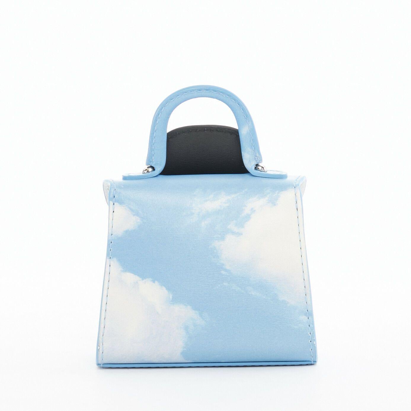 DELVAUX Rene Magritte Miniatures Belgitude bowler hat cloud print mini bag charm
DELVAUX
Knokke is mostly known as a coastal resort town where fabulous celebrities hide away for the summer. Many art connoisseurs will
appreciate this miniature as it