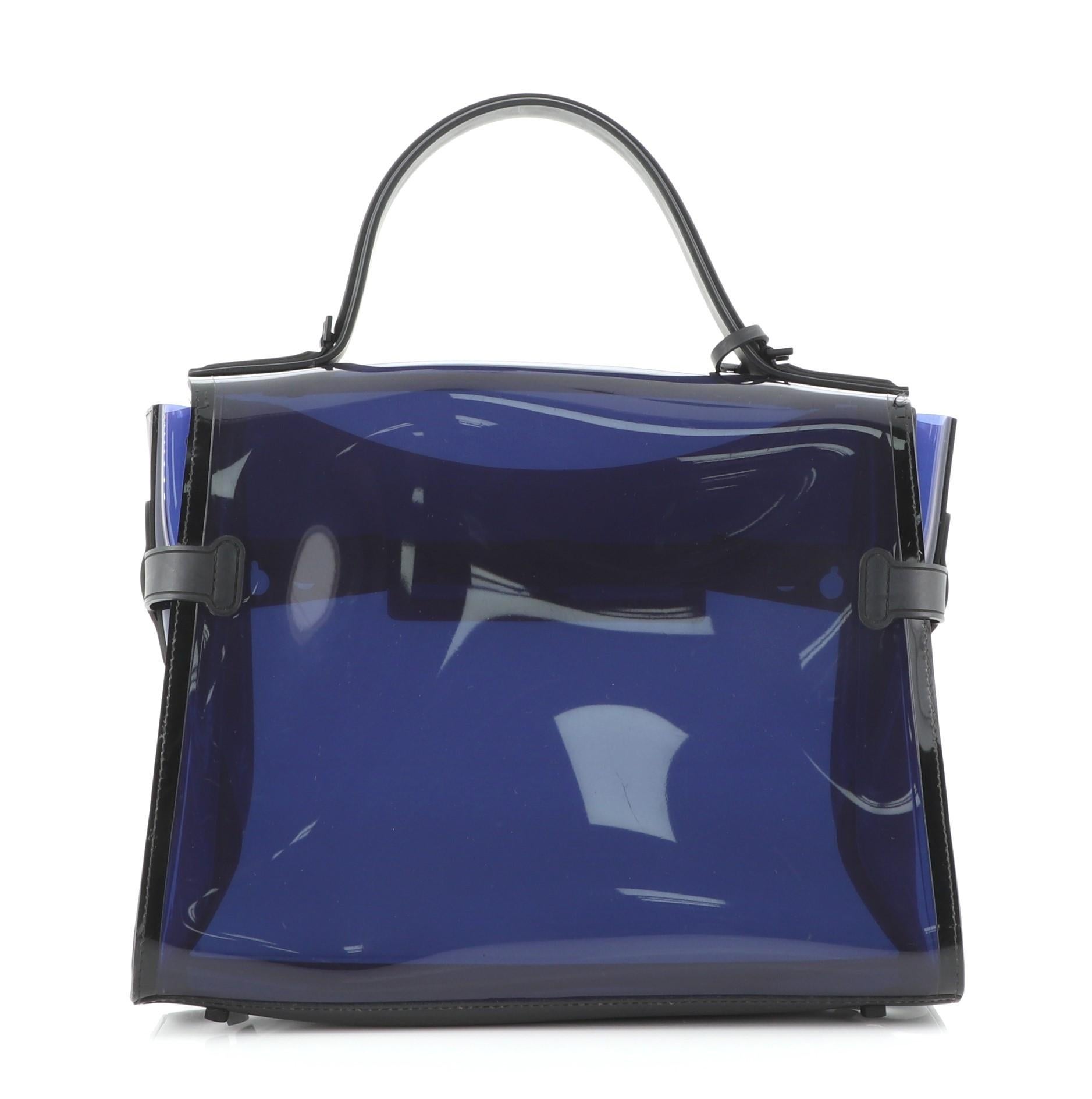 Delvaux Tempete Top Handle Bag Vinyl GM
Blue

Condition Details: Loose stitching on flap opening corner. Moderate creasing, wear and scuffs on exterior and in interior, scratches on hardware.

51012MSC

Height 10