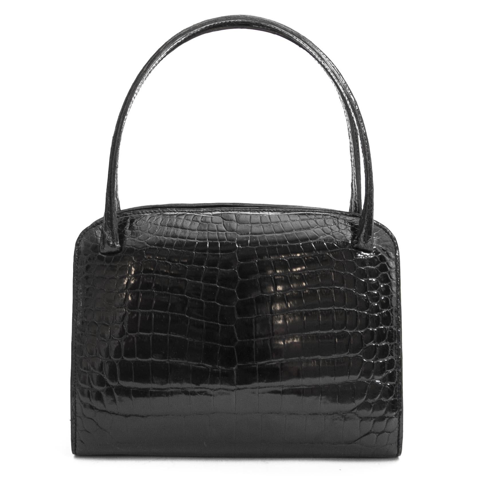 Good preloved condition

Delvaux Vintage Black Croco Bag

This stunning Delvaux bag comes in black croco leather.
The interior features black leather and three big compartments with two extra small compartments.

A beautiful and timeless bag that