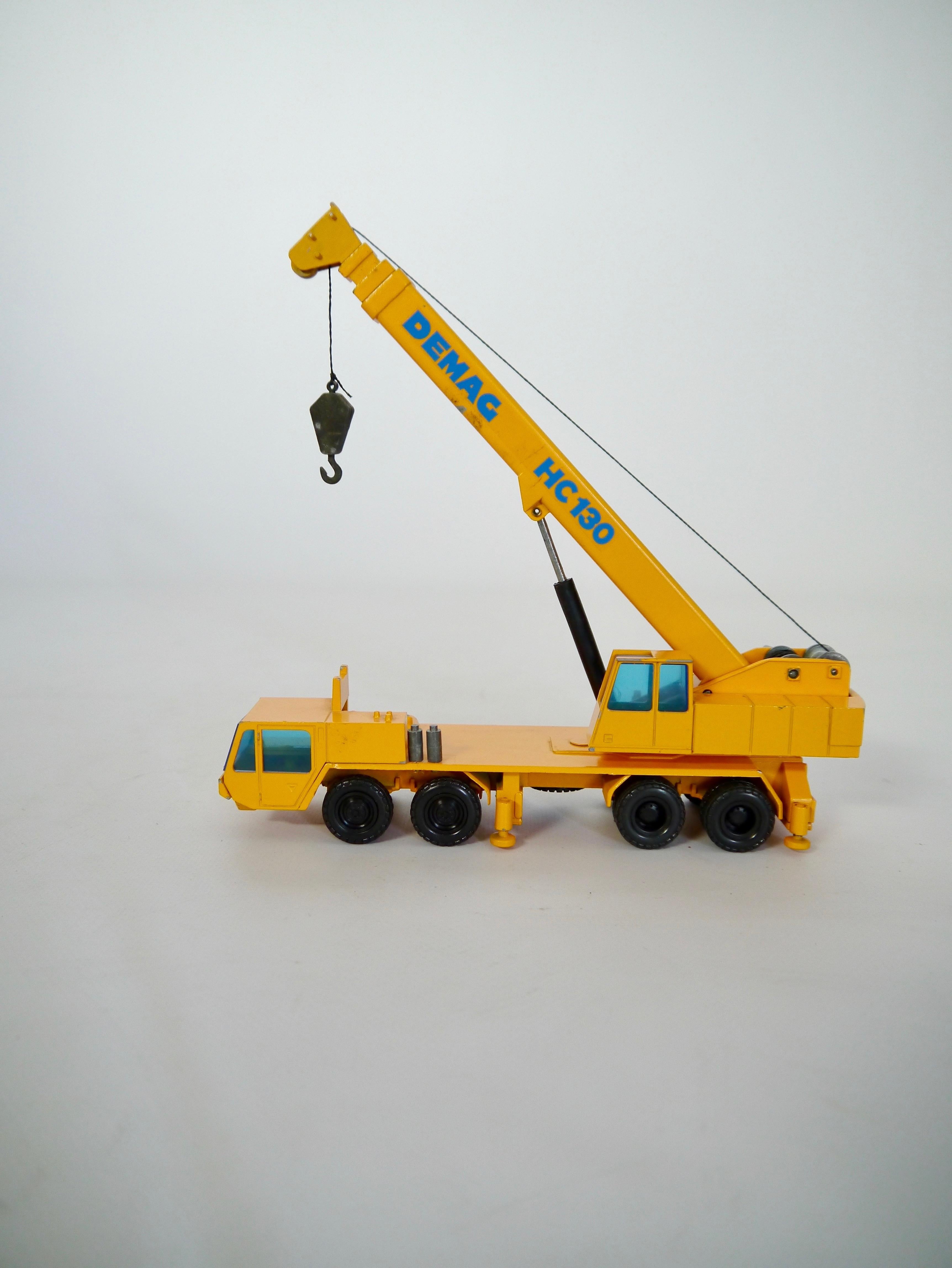 Die cast DEMAG HC130 crane truck fabricated by Nürnberger Zinkdruckguß-Modelle GmbH (NZG), West Germany 1970s. NZG is famous for specializing in collectible high quality toys and promotional models. Scale 1:50, model no 240. Weight 750gr = 26.5oz.