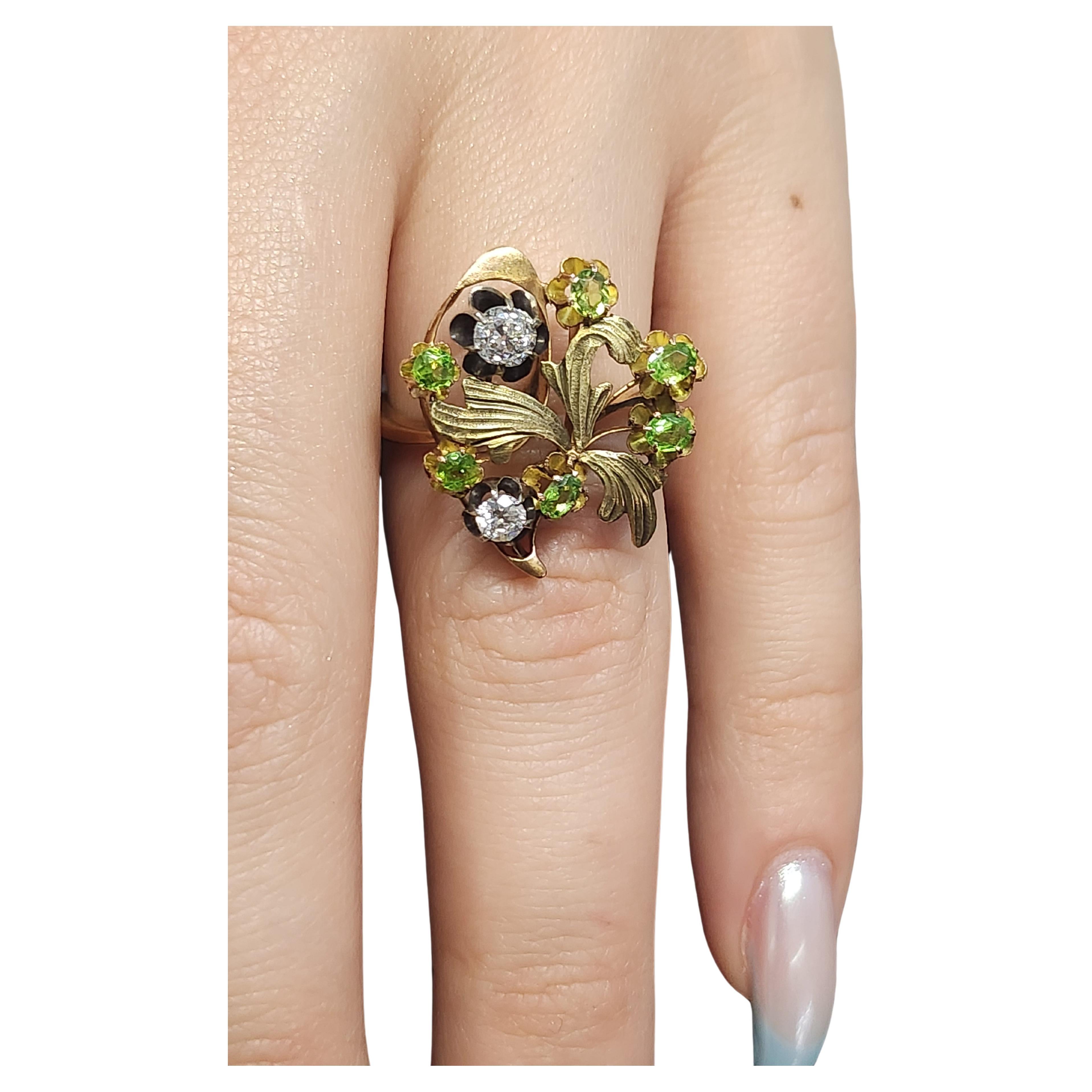  Antique large 14k gold ring in art noveu style centered with 6 natural green demantoid and 2 old mine cut diamonds estimate weight of 0.60 carats in detailed workmanship leafs and floral designe 