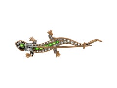 Demantoid garnet and diamond lizard brooch, circa 1880.