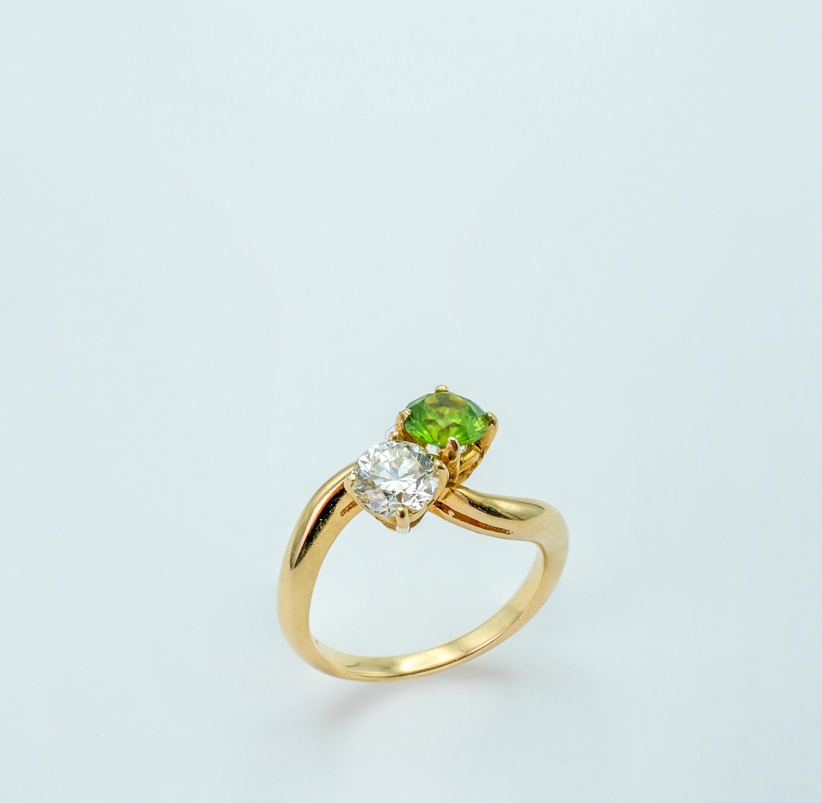 Both the demantoid garnet and the diamond featured in this jewelry piece possess exceptional qualities that contribute to their luxurious and special nature.

The demantoid garnet, with its .85ct size, exhibits a mesmerizing green color that is