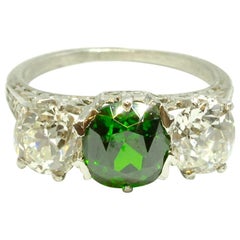 Demantoid Garnet and Old Cut Diamond Three-Stone Platinum Ring, circa 1920s