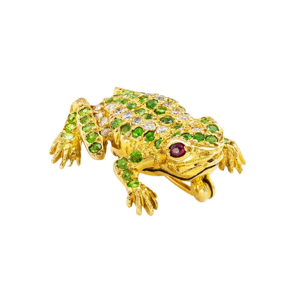 Demantoid garnets diamonds rubies and yellow gold frog brooch circa 1930.  *

ABOUT THIS ITEM:  #P-DJ627B. Scroll down for specifications.  Demantoid garnets line the body of this utterly adorable frog that looks as if it just arrived from a