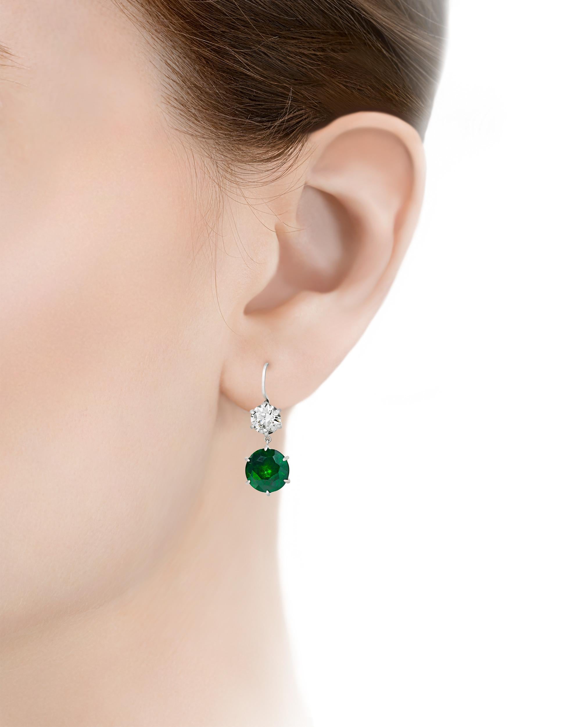 The demantoid garnet is among the rarest varieties of this coveted gemstone, and the examples in these earrings display a particularly vivid, luminous green hue. Presented by famed jeweler Raymond Yard in a classic platinum setting, the round