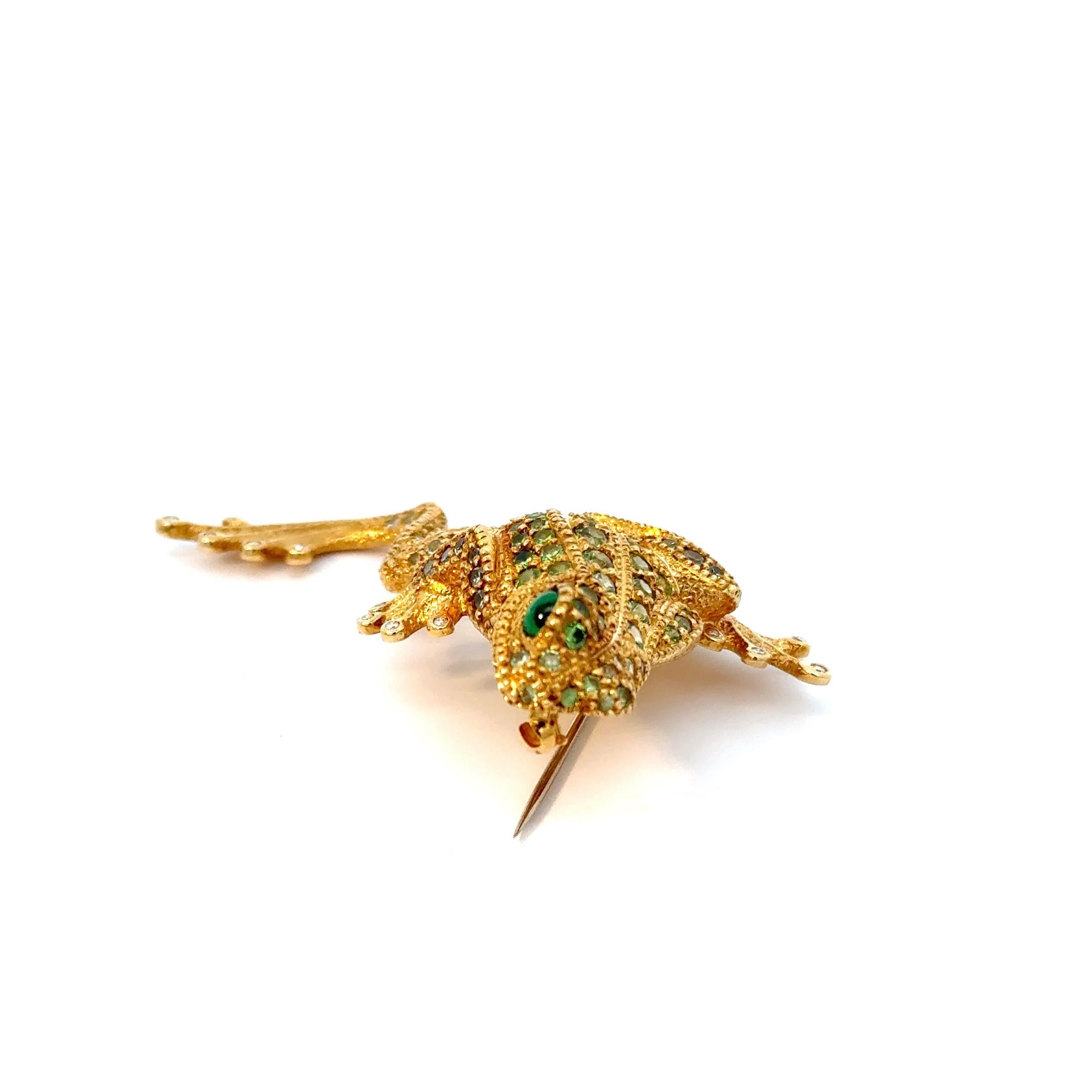Designed by gemstone-carving-master Alfred Zimmermann, following his designs of his one of a kind gemstones carvings.
This unique frog brooch has been made in our own goldsmith workshop in Idar-Oberstein. The brooch was handmade in 18ct yellow gold,
