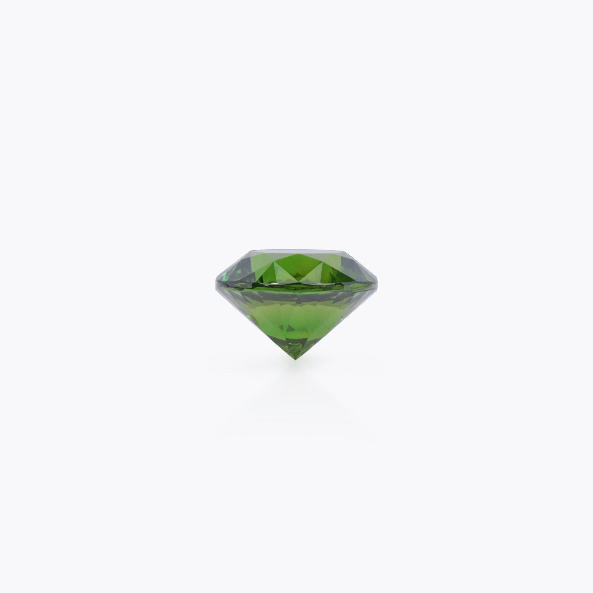 Rare and exclusive, unheated, 4.24 carat, Ural Russia, vivid green, Demantoid Garnet round gem, offered loose to a sophisticated gem collector. 
This gem displays the classic Horsetail inclusion. 
The AGL and GRS gem certificates are attached to the