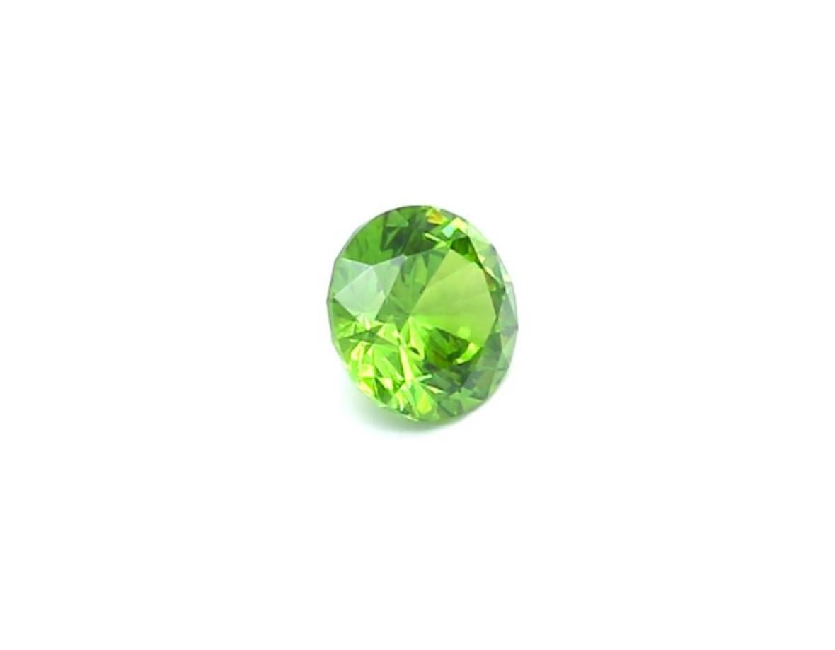 Russian Empire Demantoid Garnet with Horsetail Inclusion from Russia 0.60 Carat Weight For Sale