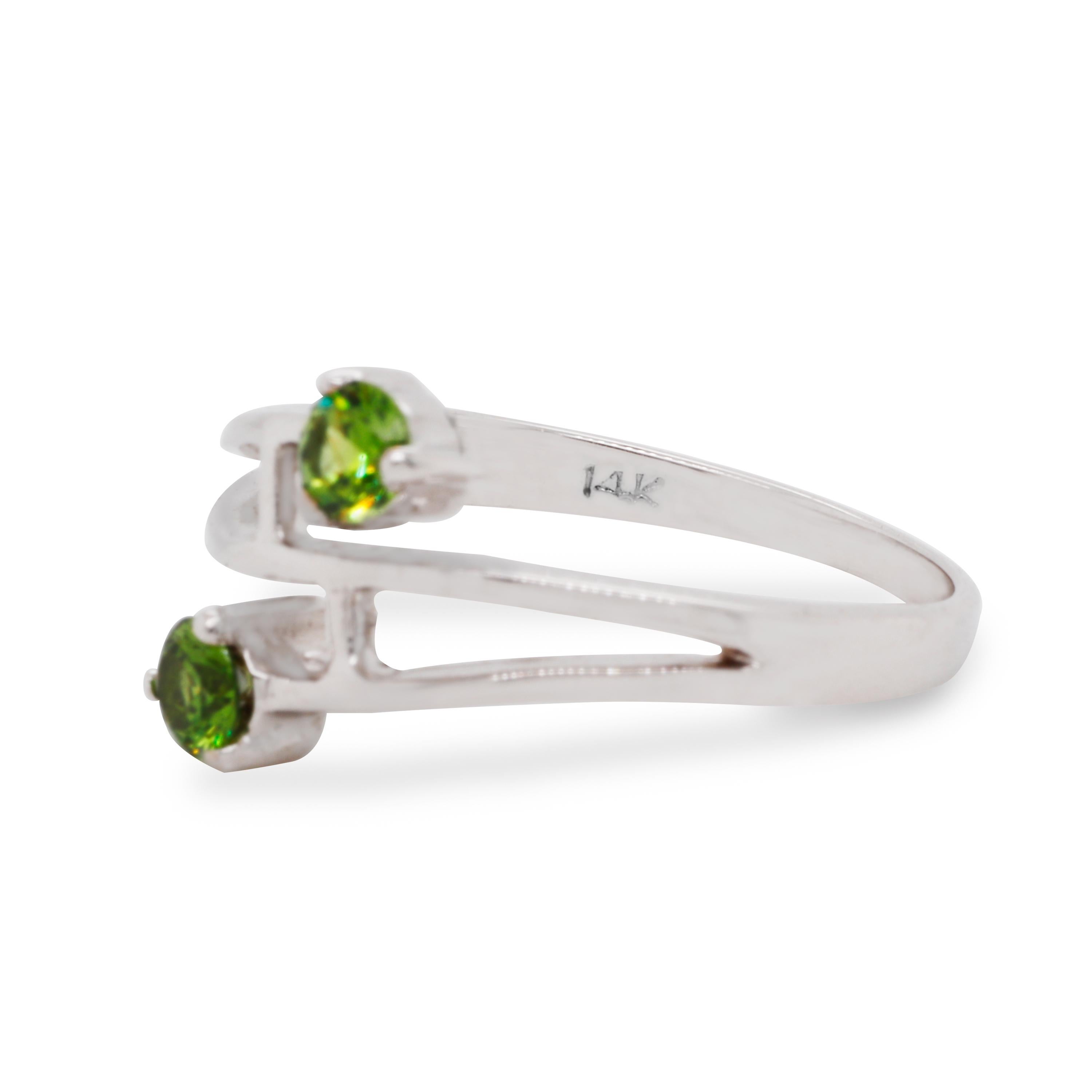 When one is not enough!
Two Russian Demantoids are pretty impressive. They have amazing fire and adorable green color! 
Use this ring anytime you need to add elegant style to your outfit.

Stones: Russian Demantoid
Weight  ~ 0.45 ct

Total weight: