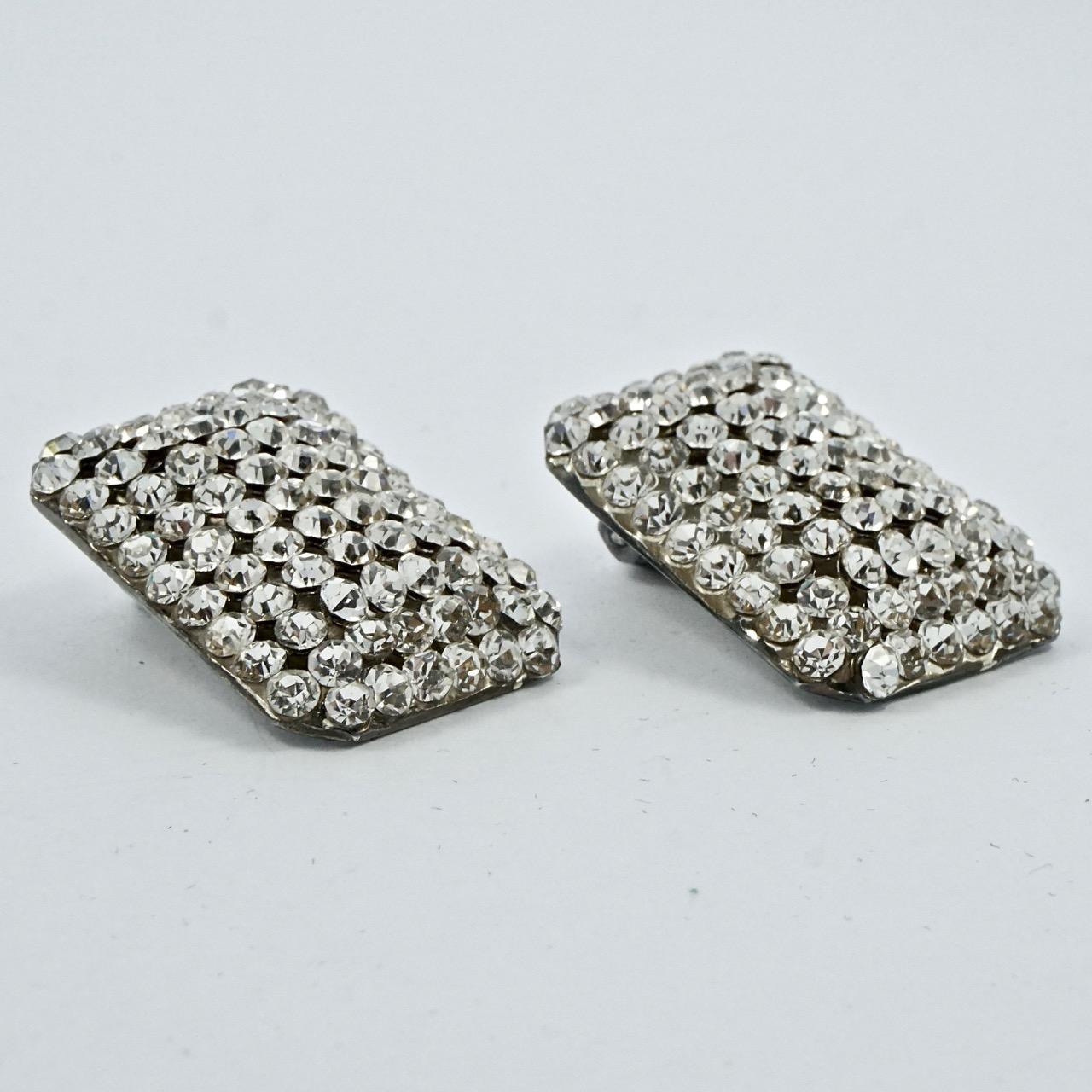
Italian beautiful Idemaria silver plated and clear rhinestone pavé clip on earrings. These rectangular earrings measure length 2.8cm / 1.1 inches by 1.95cm / .77 inch. There is some wear to the silver plating.

This is a lovely vintage pair of