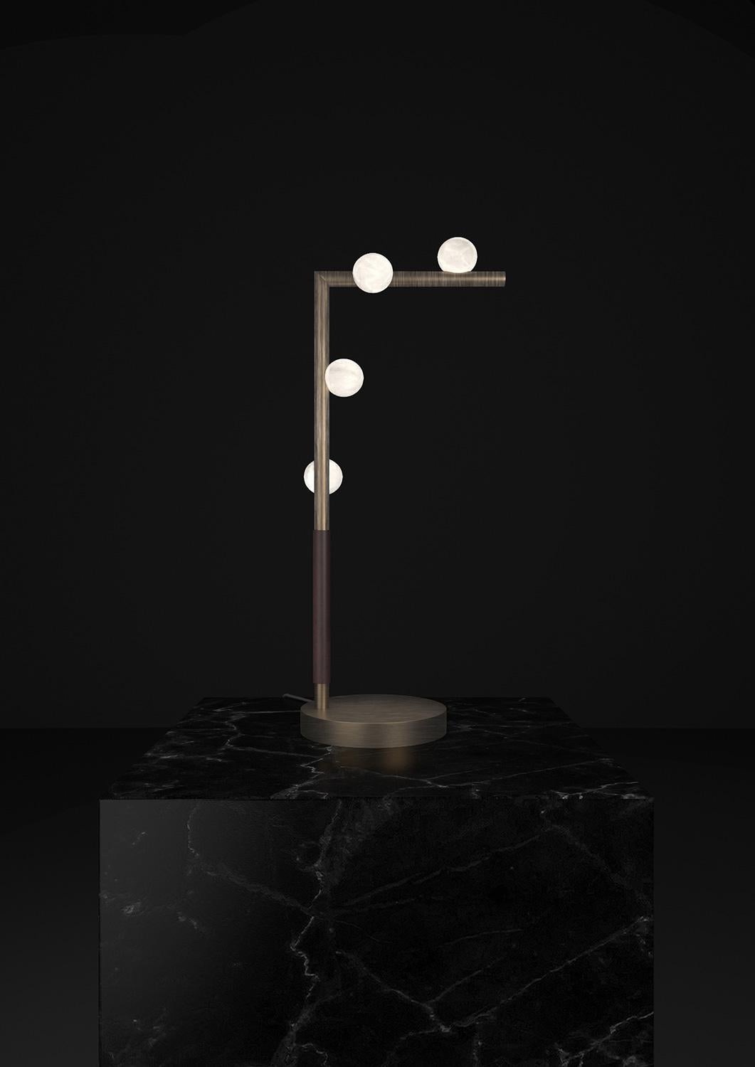 Demetra Brushed Burnished Metal Table Lamp by Alabastro Italiano
Dimensions: D 20 x W 35 x H 67 cm.
Materials: White alabaster, metal and leather.

Available in different finishes: Shiny Silver, Bronze, Brushed Brass, Ruggine of Florence, Brushed