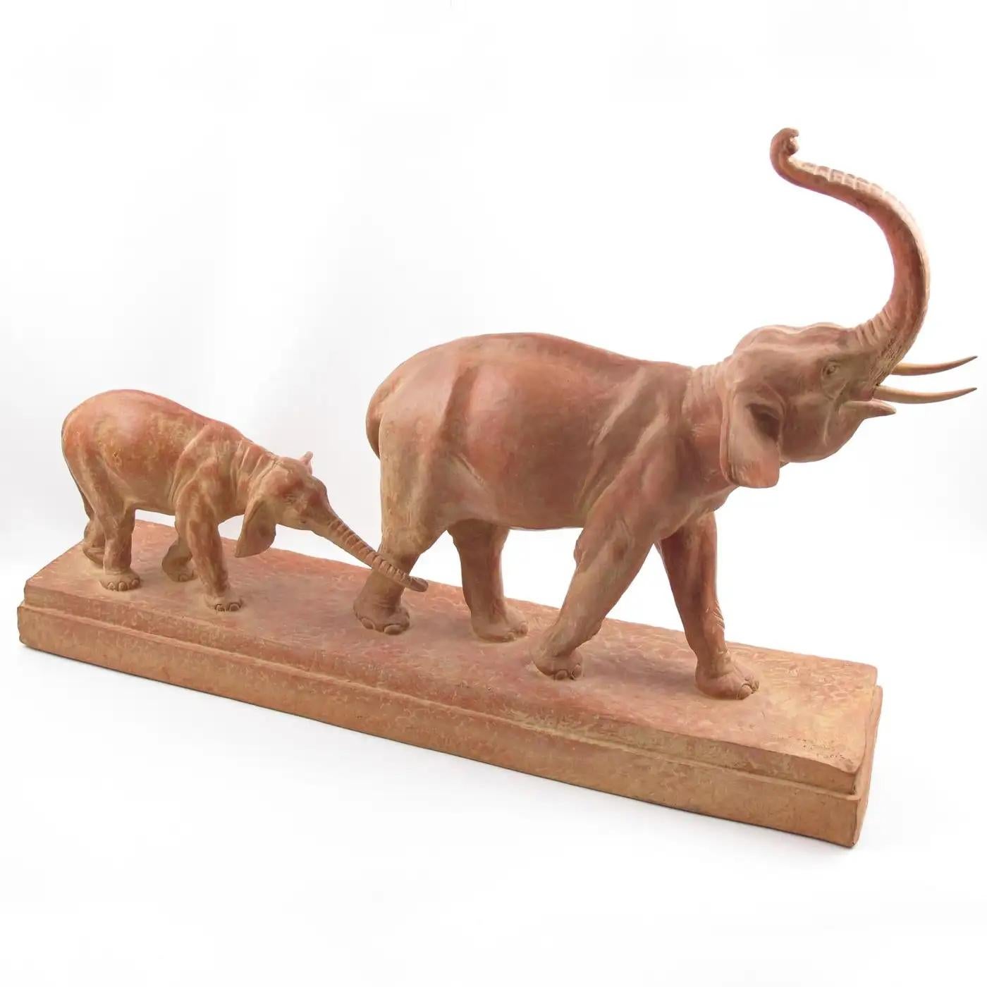 Demetre Chiparus (1888-1950) designed this gorgeous Art Deco fine terracotta sculpture. The artwork features a brown-red patinated Art Deco walking elephants on a large base. The female elephant is trumpeting and followed by her baby. The