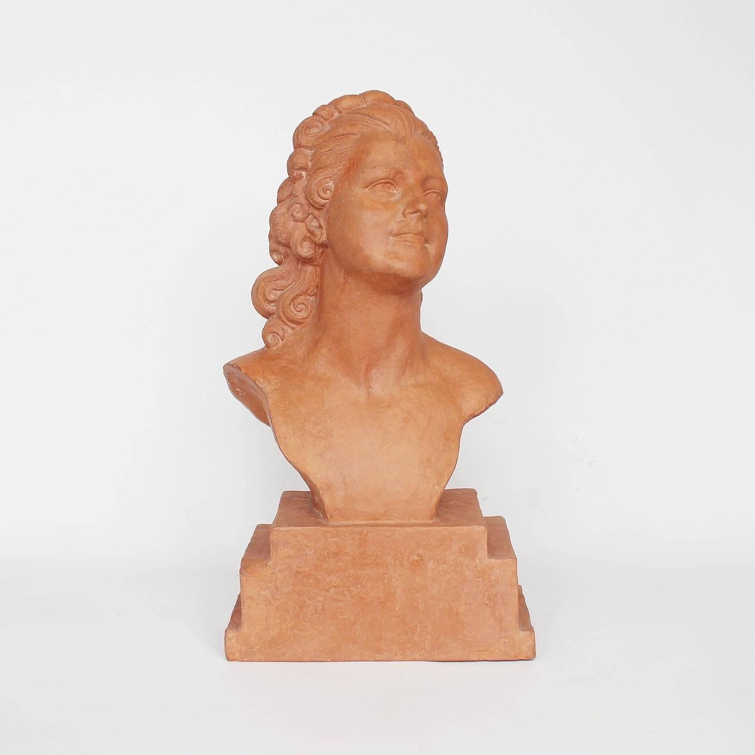 Birgitta, an Art Deco, terracotta bust of an elegant lady, set over a stepped, integral base. Inscribed Edition Reveyrolis Paris to rear. 

Signed DH Chiparus to base

Artist: Demetre Chiparus (1880-1947).
 