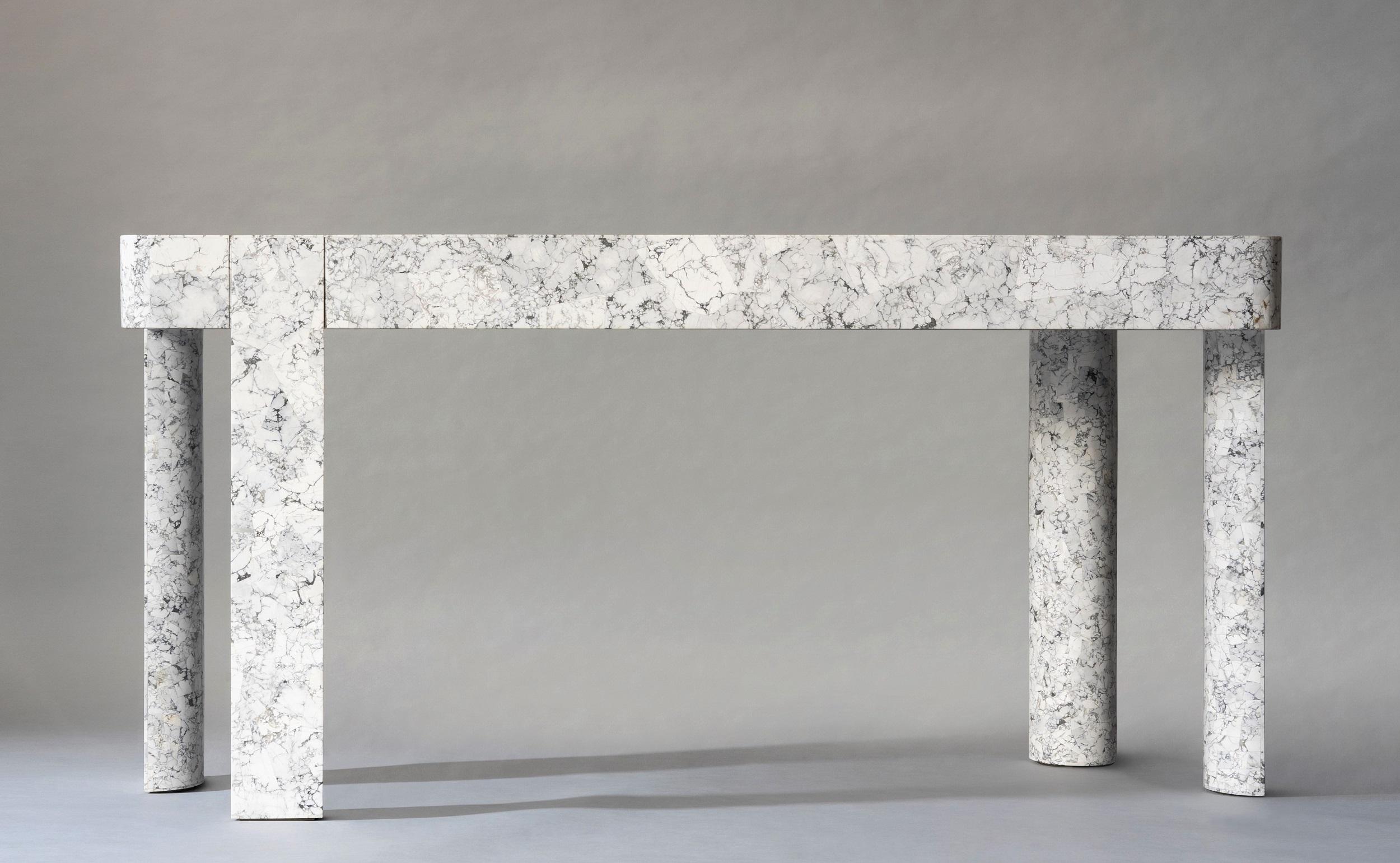 The Demi Console contrasts clean-lined elegance with the organic beauty of natural stone. Exquisite stone marquetry, hand-laid by our master craftsmen, creates a dynamic display of pattern and coloration in an otherwise minimal design. Careful