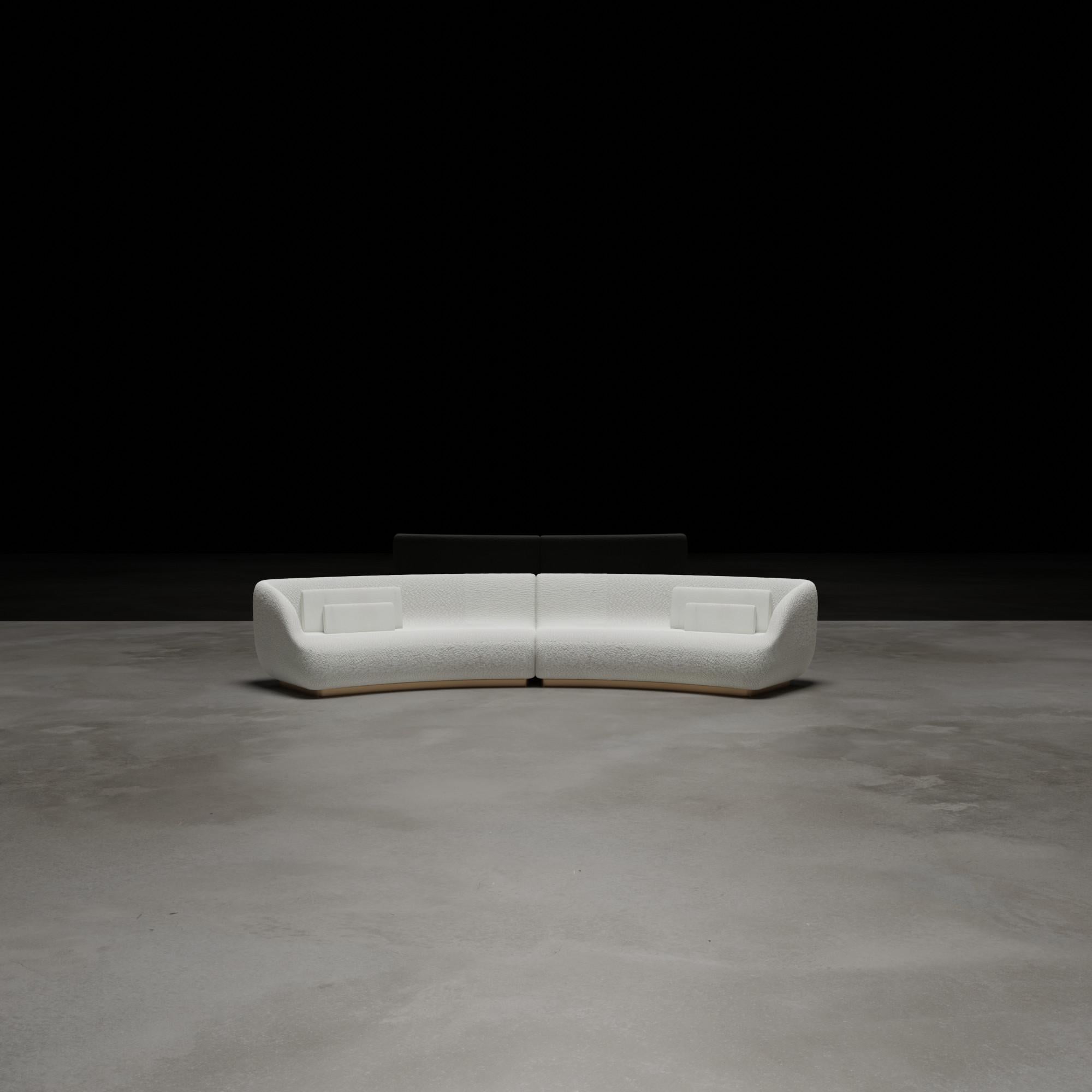 The 2021 Edition to our Canapé sofa series, demi-lune. Elegantly curved and comprised of two elements that can also stand alone or separate to accommodate a center positioned cocktail table or side cabinet, shown in wool bouclé with standard hand