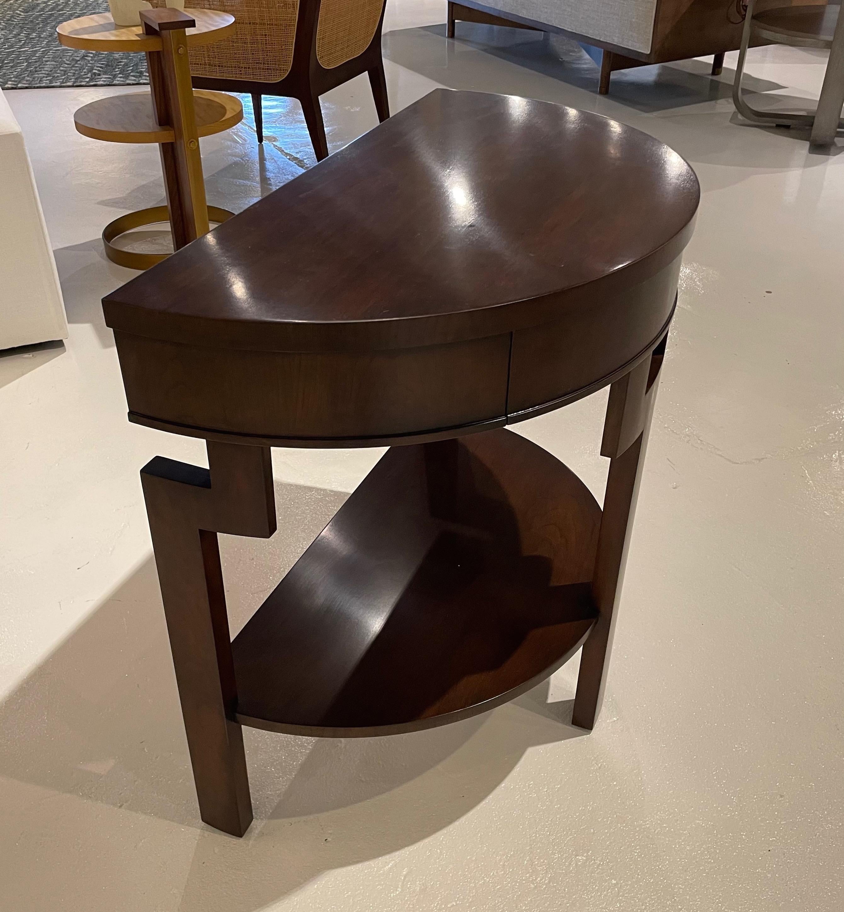 Showroom new - from the Dorothy Draper Archives this table has a lovely demilune shape and Chippendale inspired style. The table houses one drawer that disappears into the apron. This piece is perfect sofa side, bed side or in a hallway or entry.