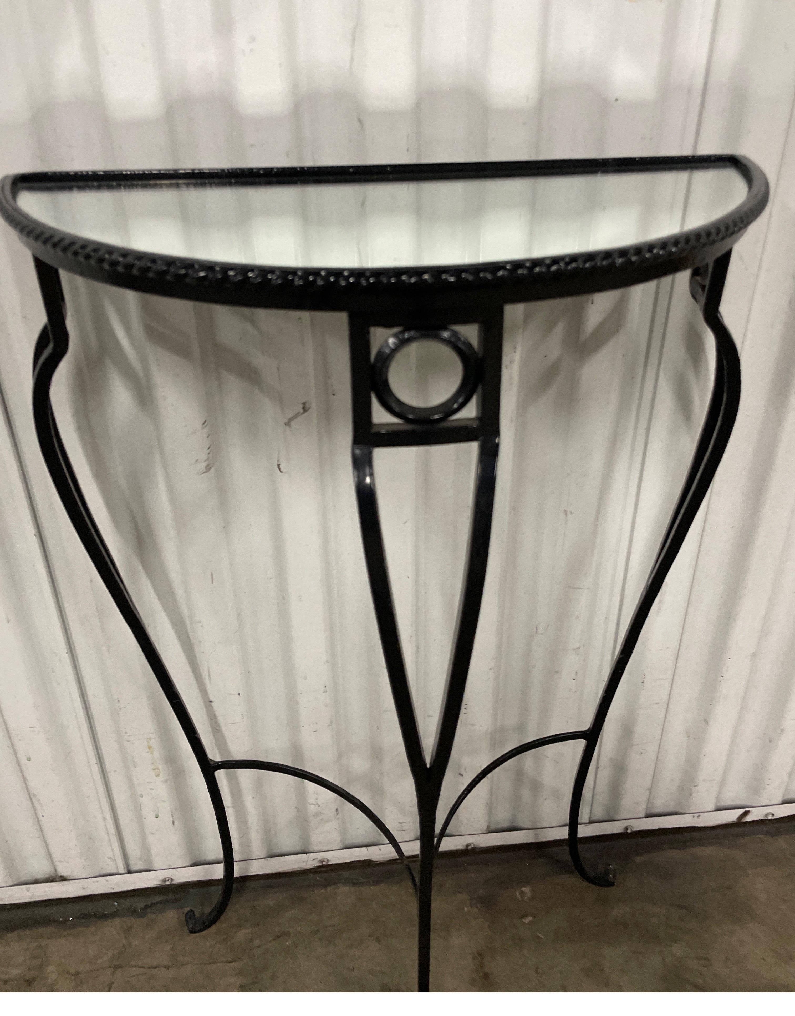 Small demi lune wrought iron console with mirrored top. Perfect for that small entryway or powder room.