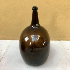 Bouteille Demijohn en verre brun foncé Début du 20e siècle Mexique