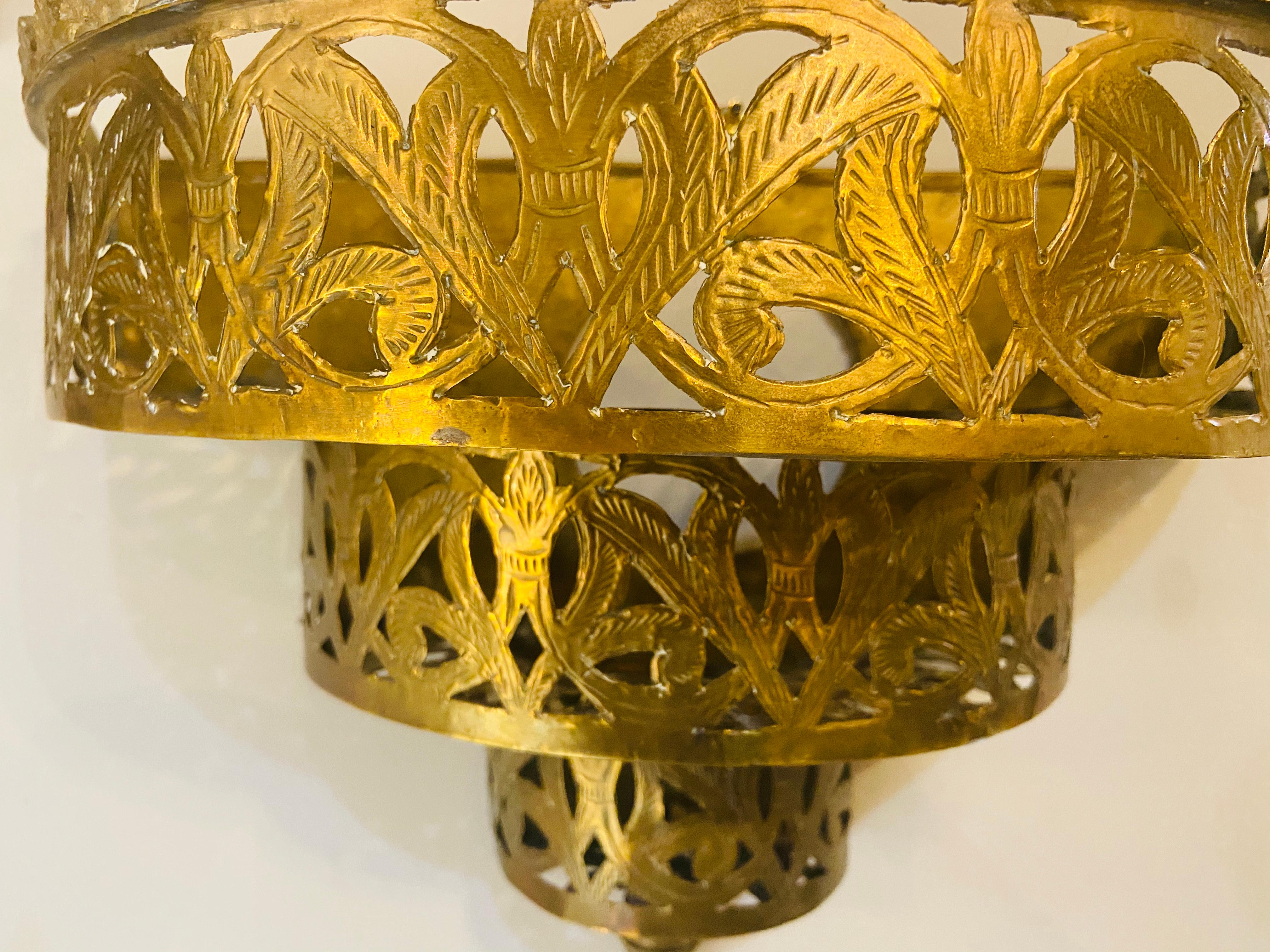 Demilune brass Moroccan wall sconce, a pair
The pair of wall sconces are beautifully handmade using filigree style to create a stylish Moorish design in a demilune shape. The sconces are made of brass and are not wired.
They can be wired upon