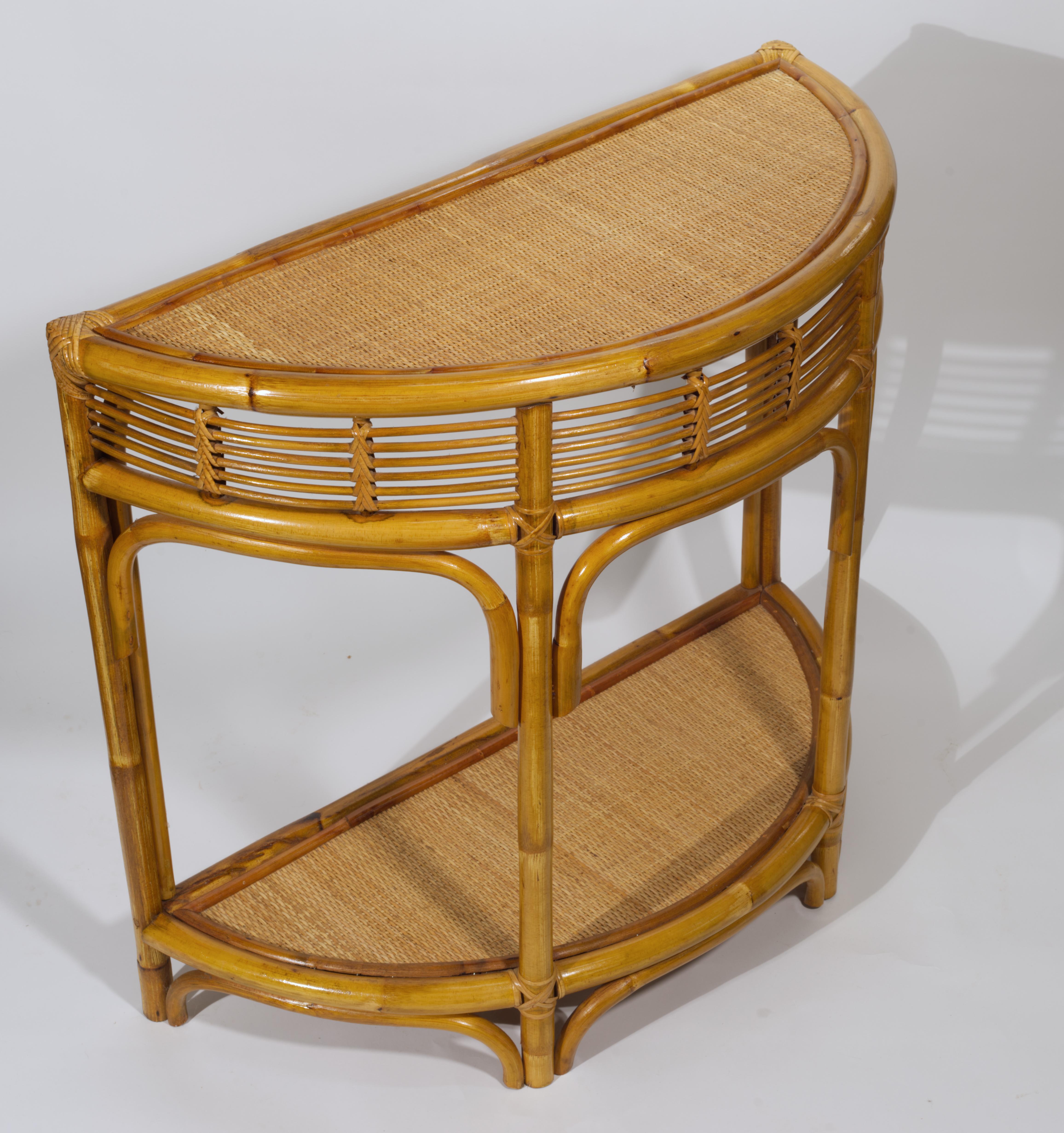  Vintage Mid Century Modern demilune console table features elegant, functional design and organic, natural materials. The table is supported by 4 bamboo legs that are reinforced with arching support elements; the bottom shelf adds functionality