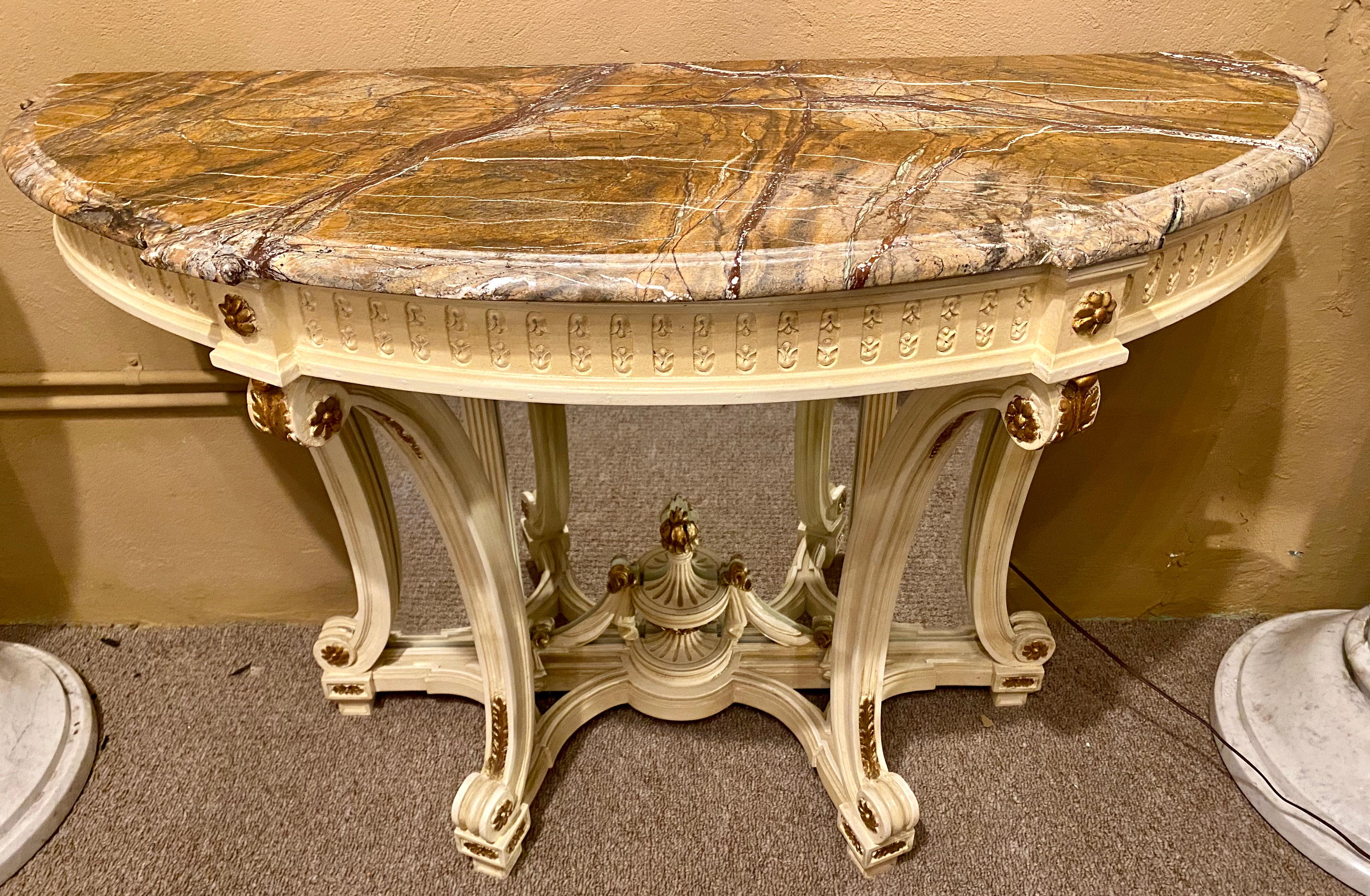 Demilune Hollywood Regency style marble-top console or serving table. A fine custom quality parcel gilt and crème paint decorated beveled mirror back console, serving or sofa table. With sprayed legs and a carved undercarriage. Beveled mirror three
