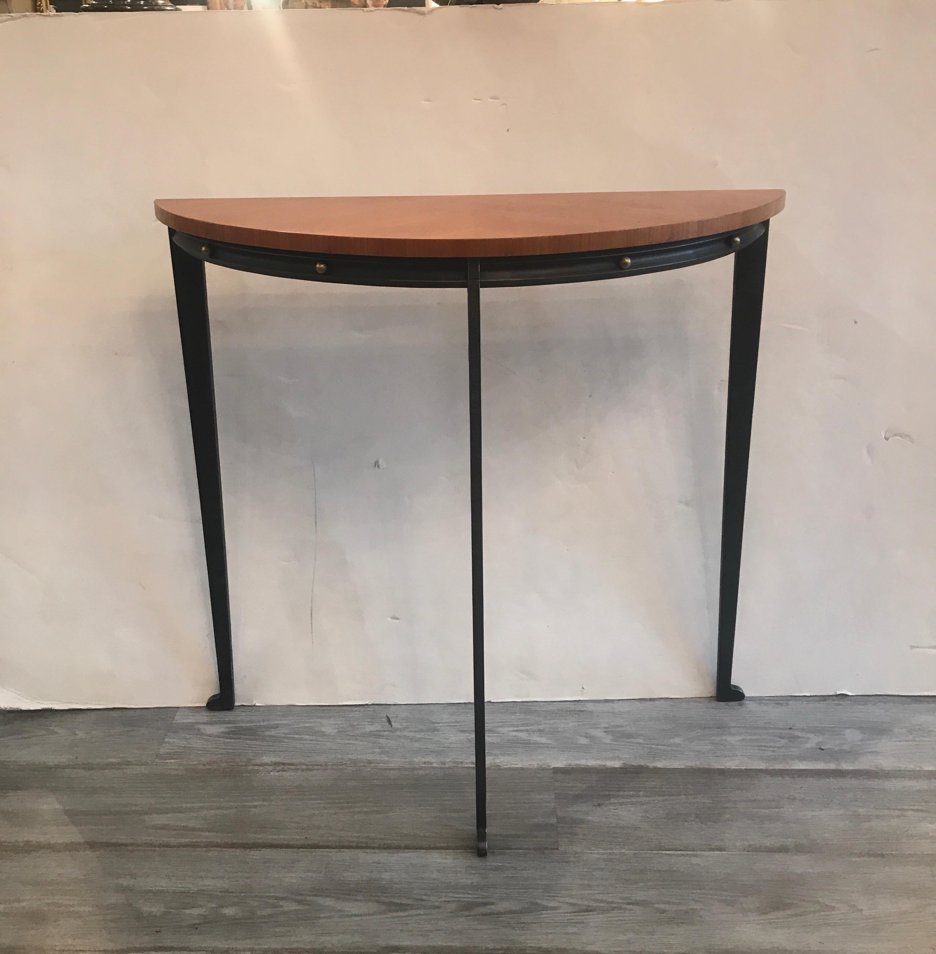 A grey steel and birch wood Demilune console table by NYC designer Will Stone. The table base of steel with small brass details on the apron with a book matched birch wood top. Signed on one leg, Will Stone...