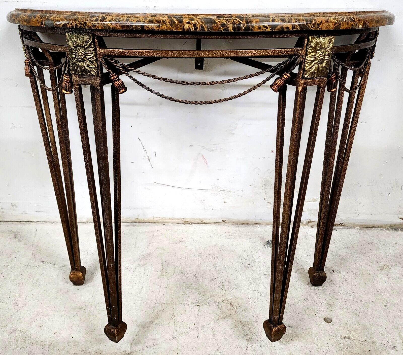 For FULL item description click on CONTINUE READING at the bottom of this page.

Offering One Of Our Recent Palm Beach Estate Fine Furniture Acquisitions Of An 
Iron Rope & Tassel Tessellated Marble Demilune Console Table After Oscar Bach with