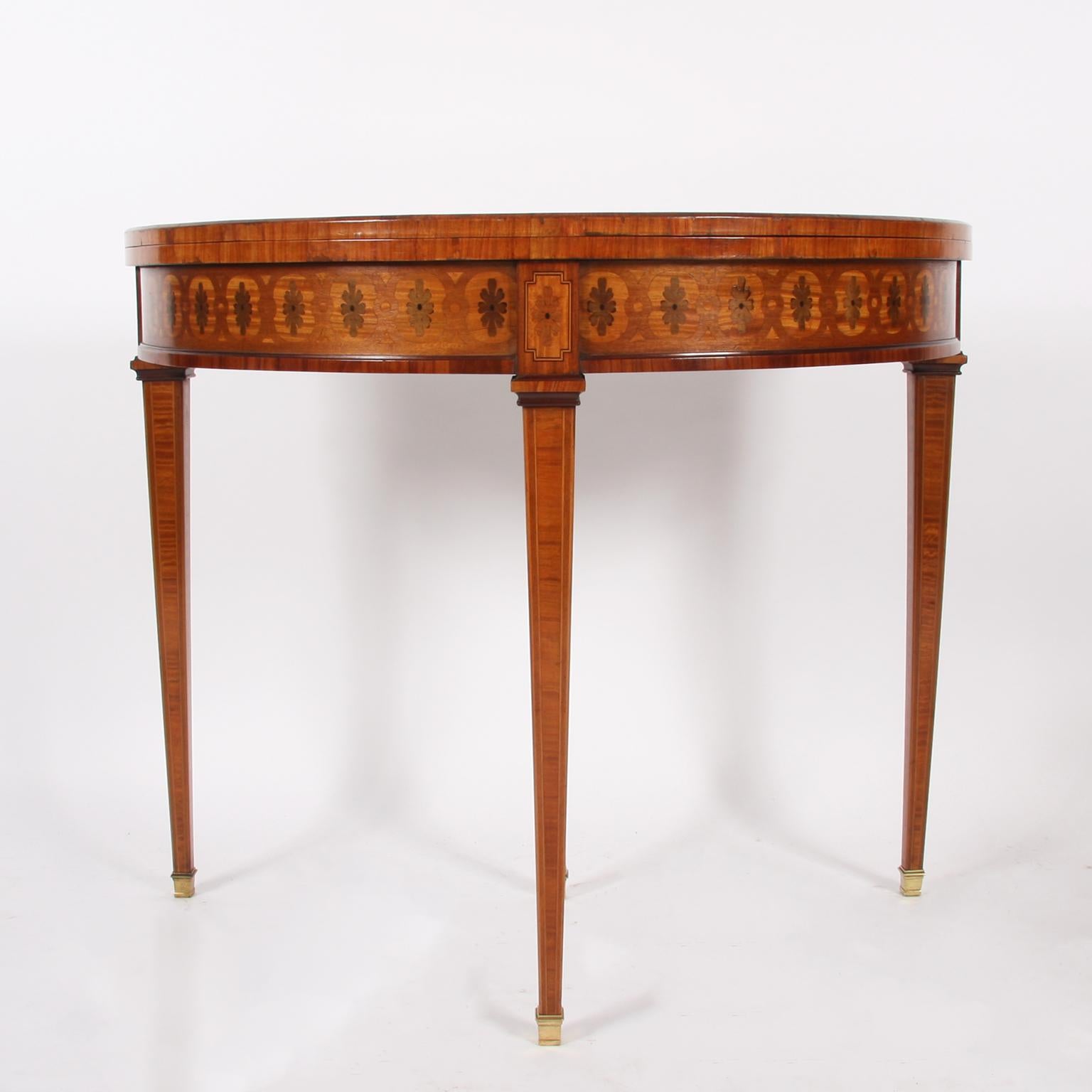French, 19th century.

A superb demi lune card table, with beautiful parquetry. 

Very good condition. 

Wear consistent with age and use.