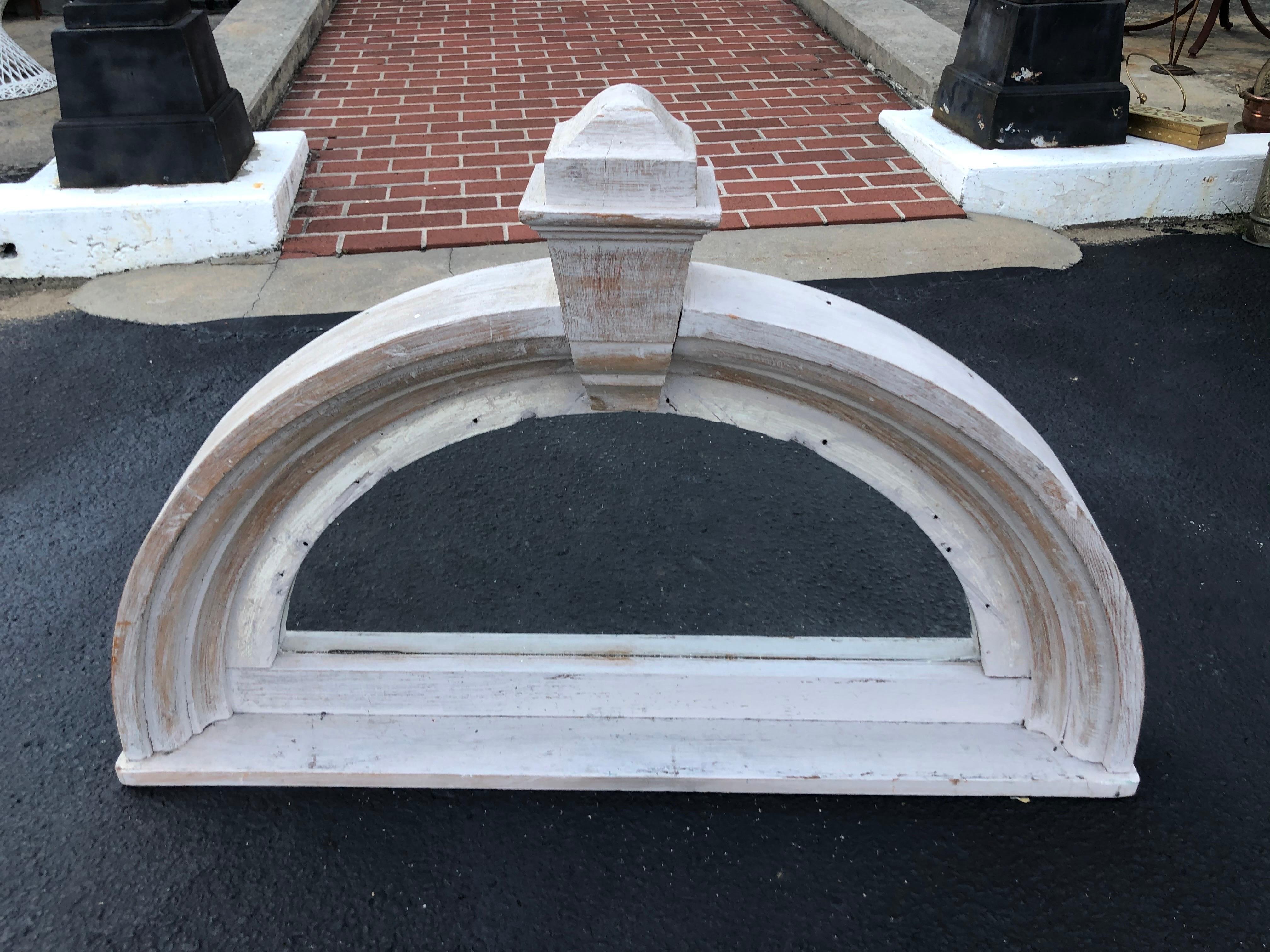 Half round pediment mirror of washed country pine. Nice architectural piece perfect for that country farmhouse. Great mirror for over a mantel or console. Use as a headboard or above a bed.
 