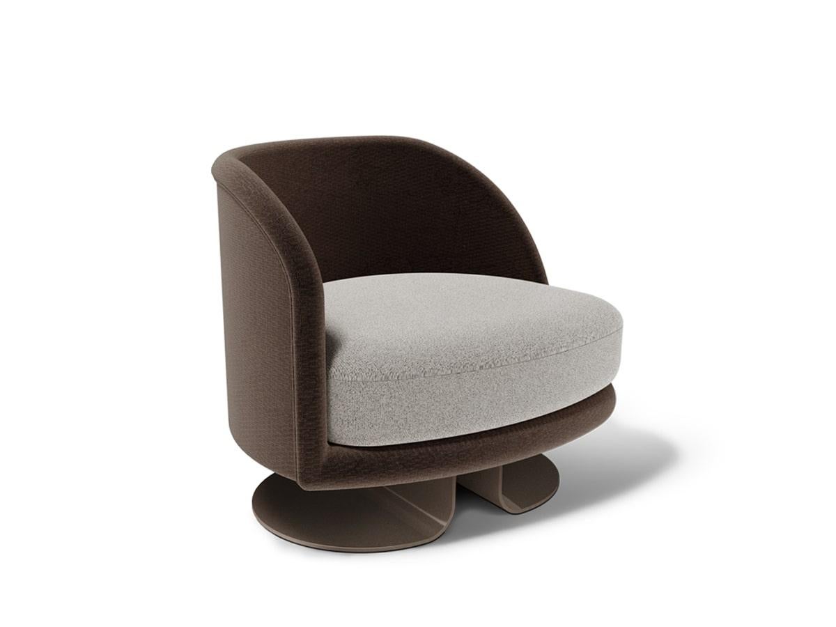 The Modern Demitasse Ergonomic Armchair by Caffe Latte is flawlessly curved to embrace the user, ergonomy is the keyword for this piece with its sublime design and soft seating. Its discreet wide and elegant foot is made with Epoxy Iron Bronze Matte