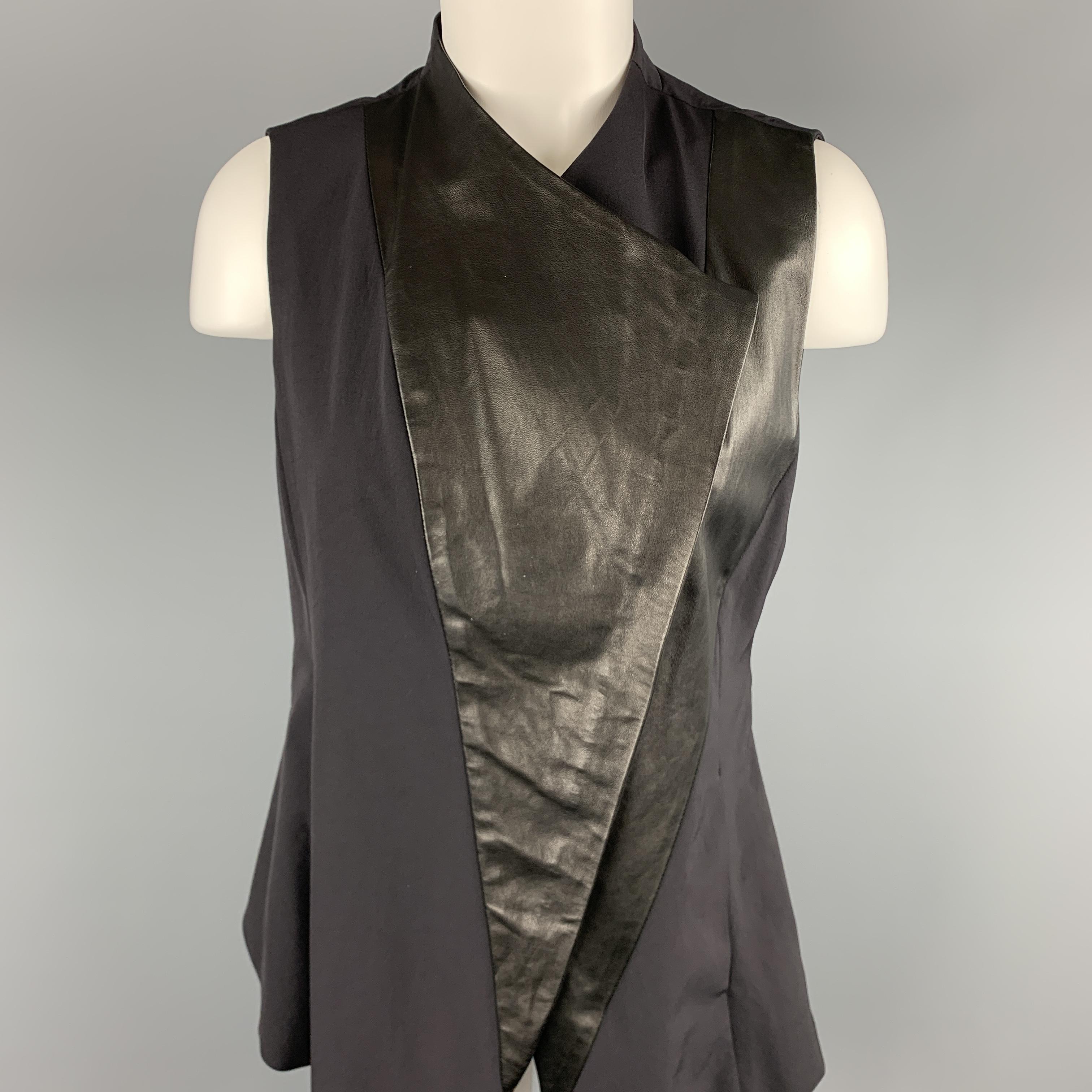 DEMOO PARKCHOONMO vest comes in black crepe with a chiffon, belted back, and leather panel asymmetrical zip front. 

Excellent Pre-Owned Condition.
Marked: (no size)

Measurements:

Shoulder: 12 in.
Bust: 36 in.
Length: 32 in.