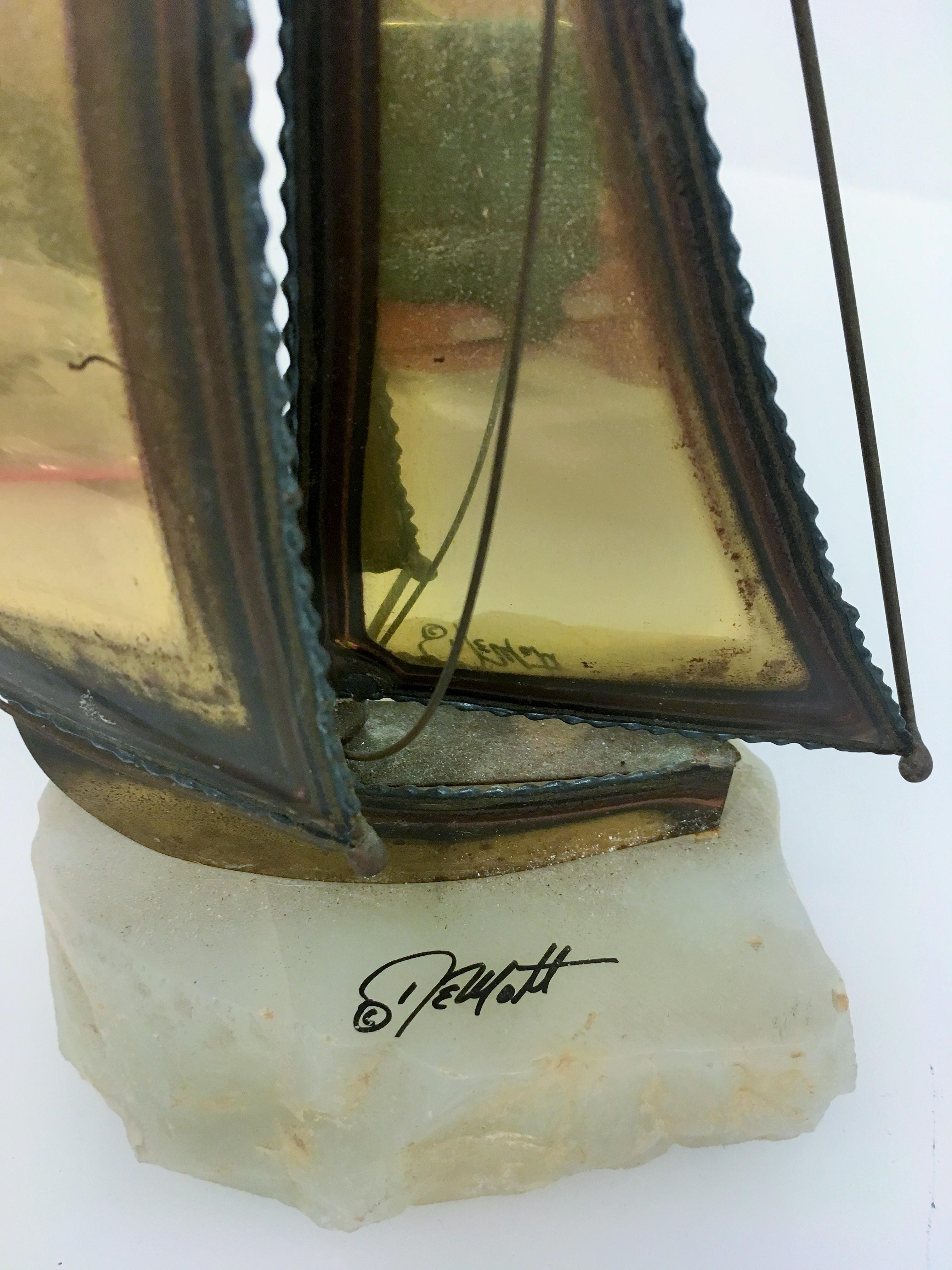 Signed Demott brass sailboat sculpture. Mounted on onyx.