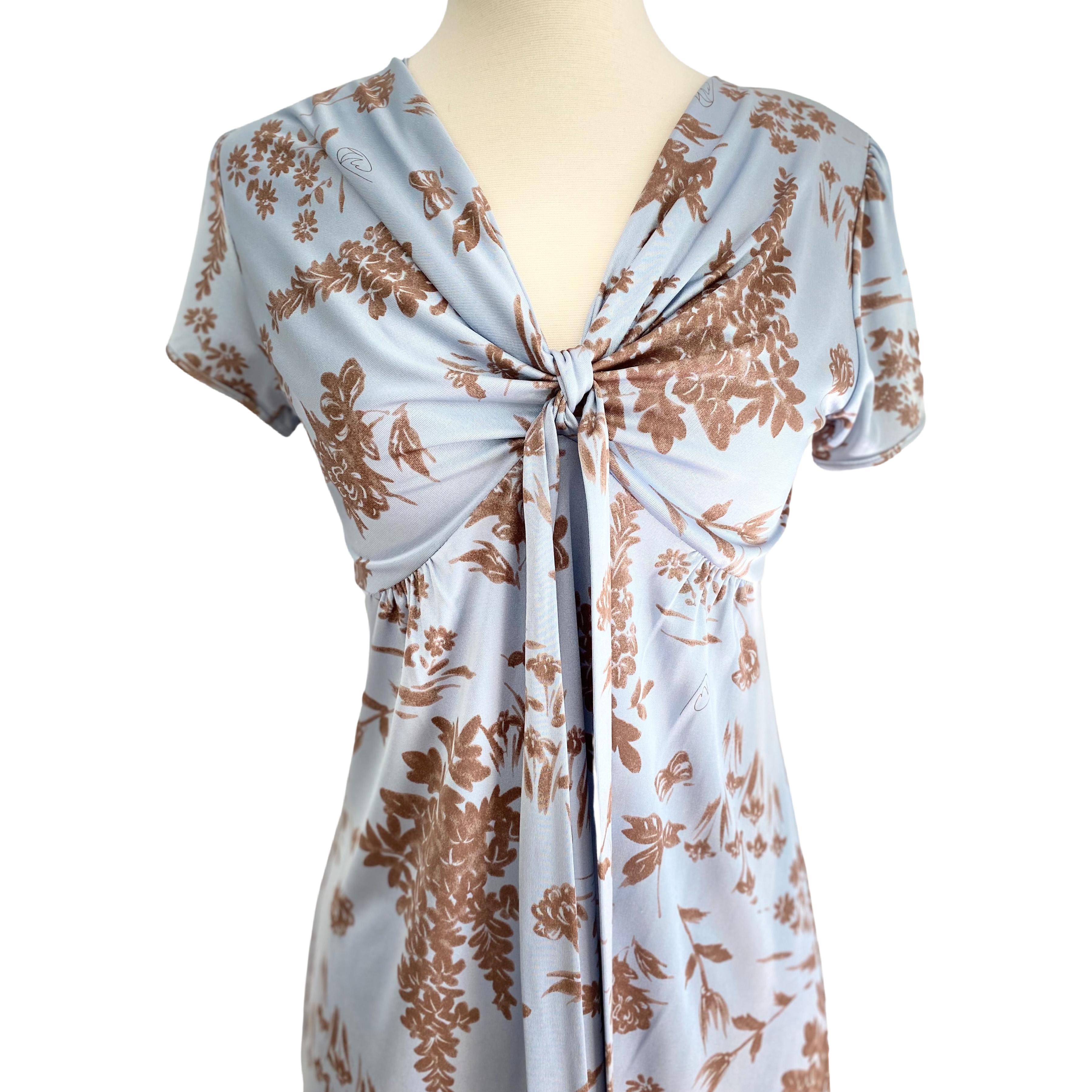 In Flora's original 2-tone wheatberry on pale blue print.
Gentle puff sleeves.
Self-tie at bust for a perfect, flattering fit. 
Approximately 40