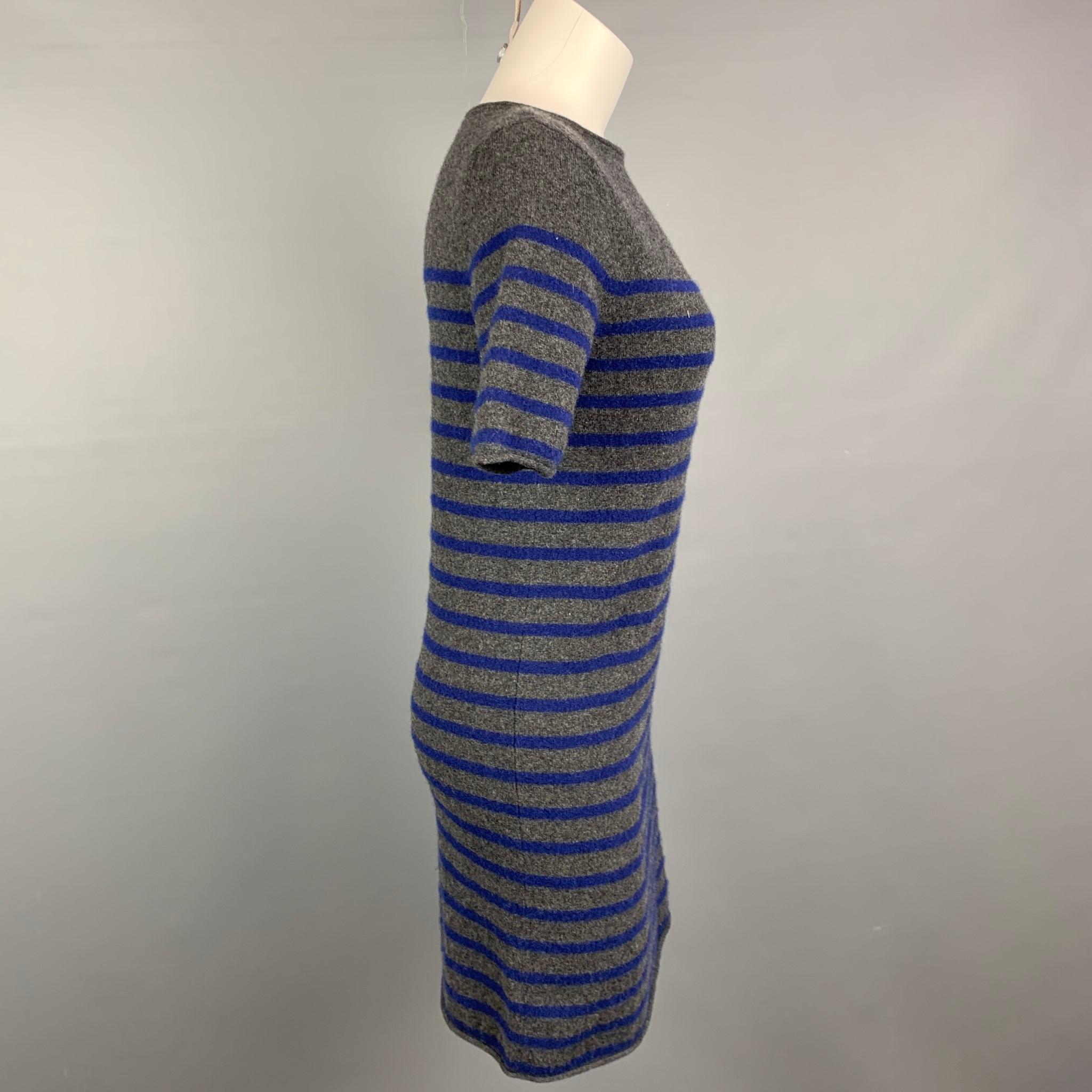 DEMYLEE dress comes in a grey & navy knitted stripe cashmere featuring a shift style, short sleeves, and a crew-neck.

Very Good Pre-Owned Condition.
Marked: S

Measurements:

Shoulder: 15 in.
Bust: 34 in.
Hip: 33 in.
Sleeve: 11 in.
Length: 32 in. 