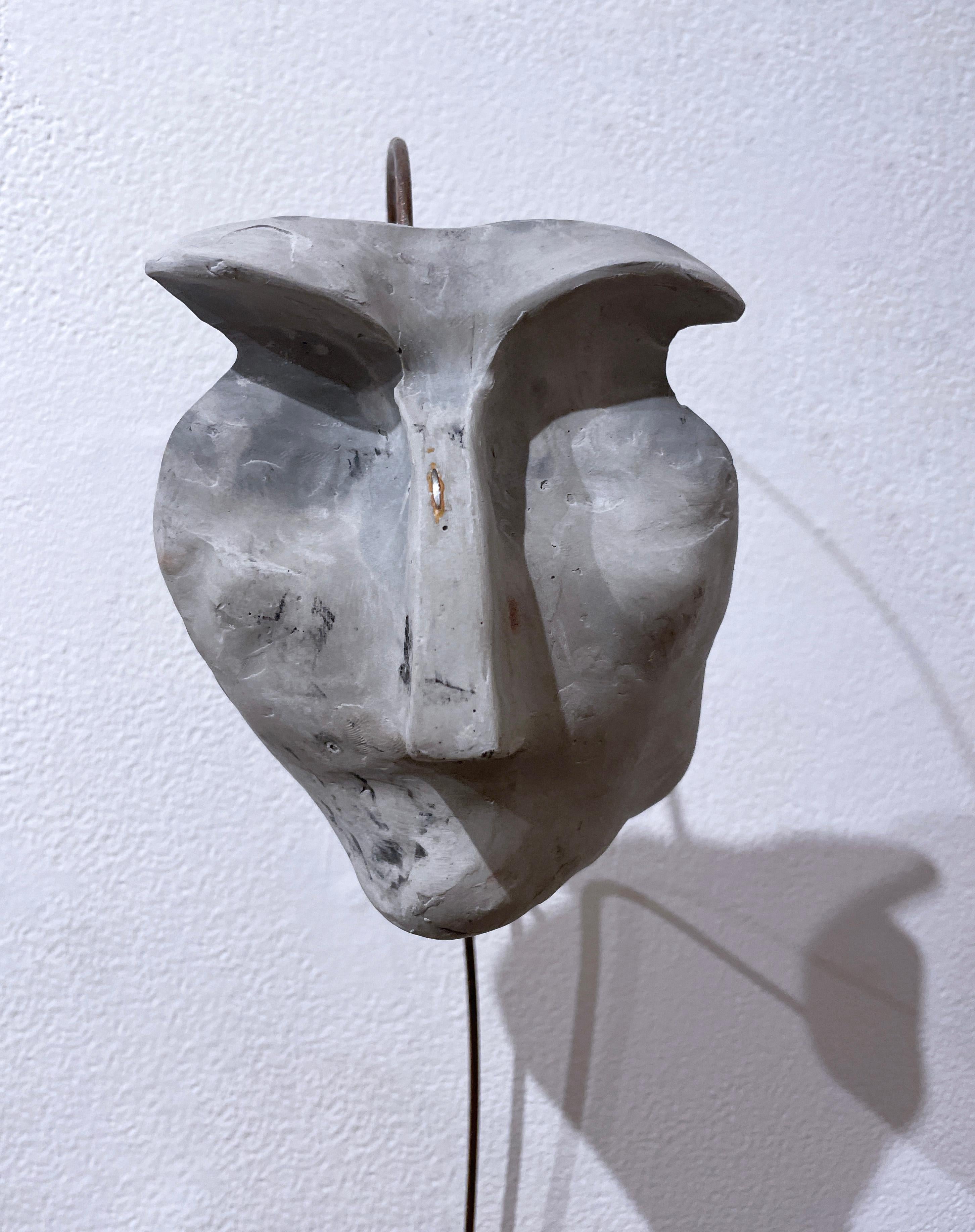 Speckled Sage (2022), gray concrete abstract face sculpture, metal wire, earthy