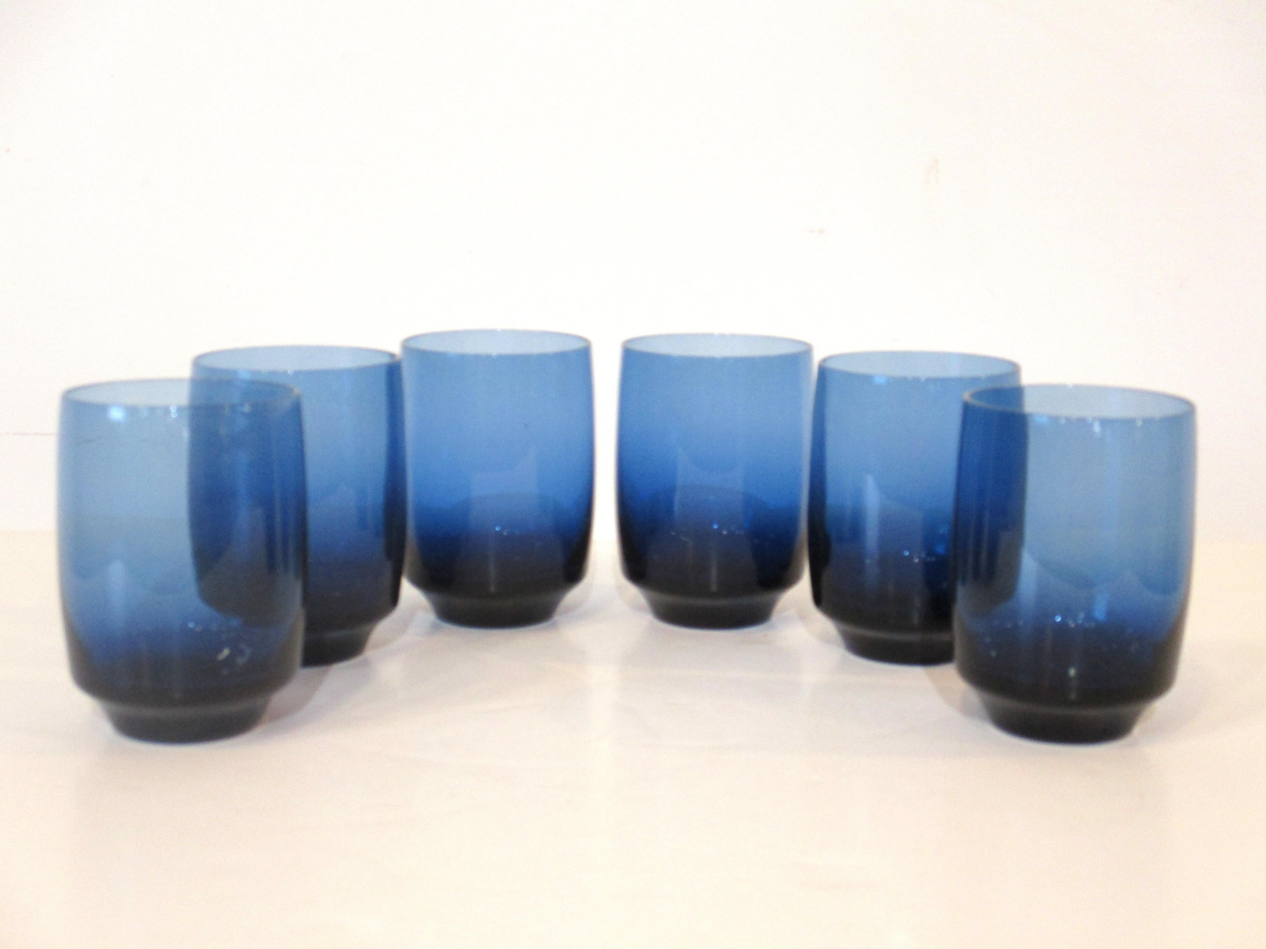 A set of six beautifully and ergonomically crafted low sized tumblers in Vista Ice Blue this color is really reminiscent of Scandinavia. Well balanced and nice feeling in your hands these are NOS ( new old stock ) still in the original packing and