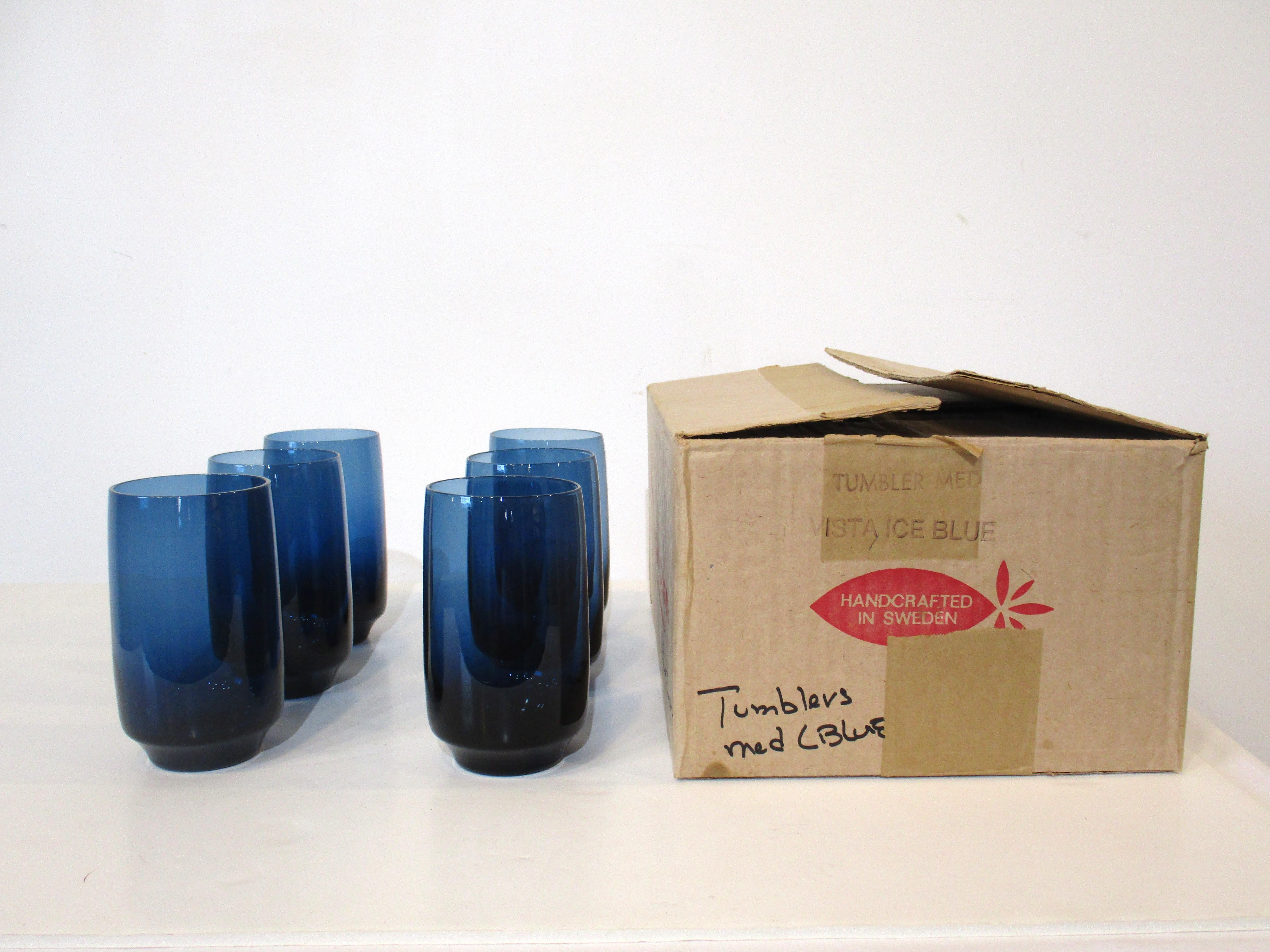 A set of six beautifully and ergonomically crafted medium sized tumblers in Vista Ice Blue this color is really reminiscent of Scandinavia. Well balanced and nice feeling in your hands these are NOS ( new old stock ) still in the original packing