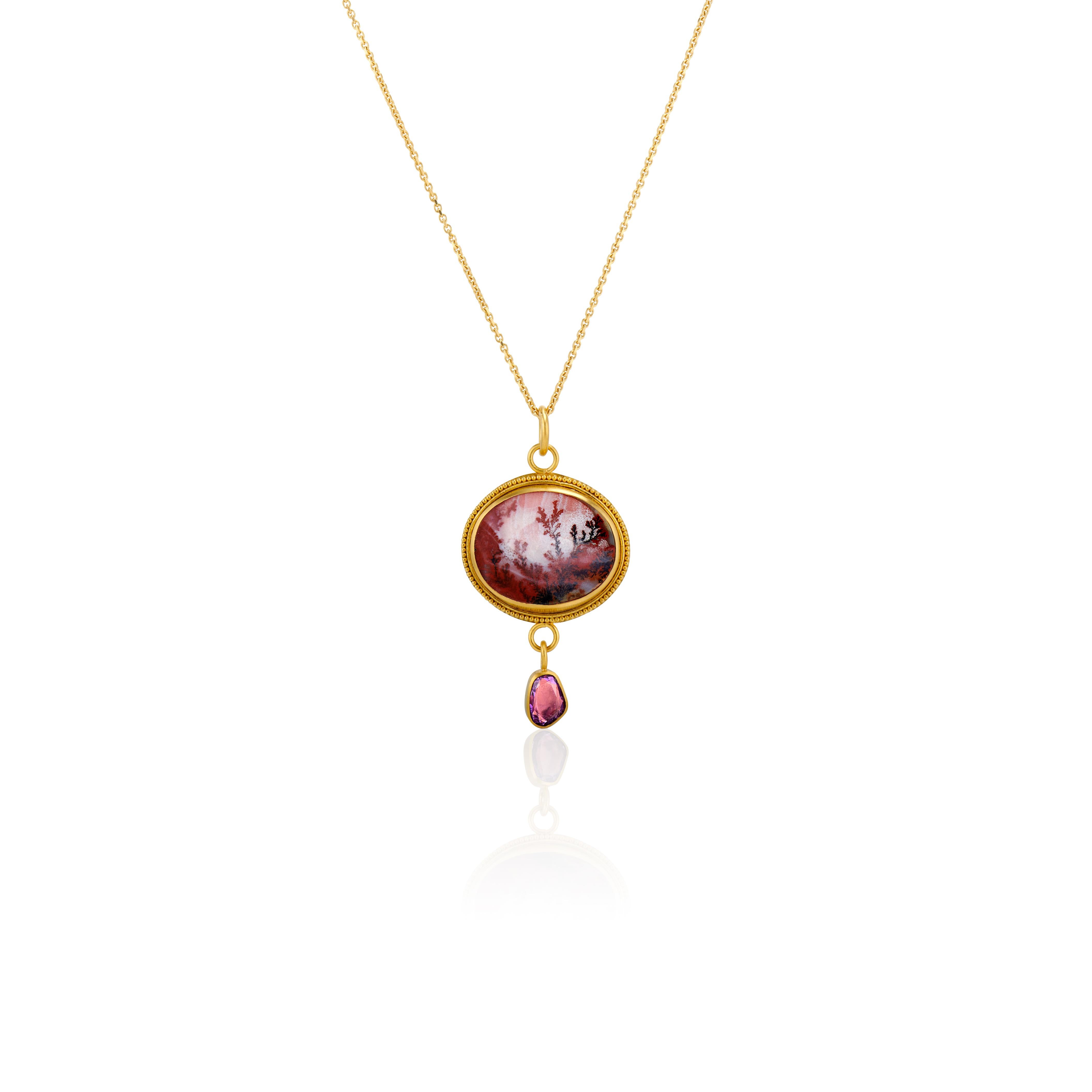 In a mist of dreamy soft violet and plum, this outstanding oval dendritic agate (1.06 x .8 inches) creates a magical world like Shangri-la or Brigadoon.  A bezel of 22 karat yellow gold and a single row of granulation frames the dendritic agate like