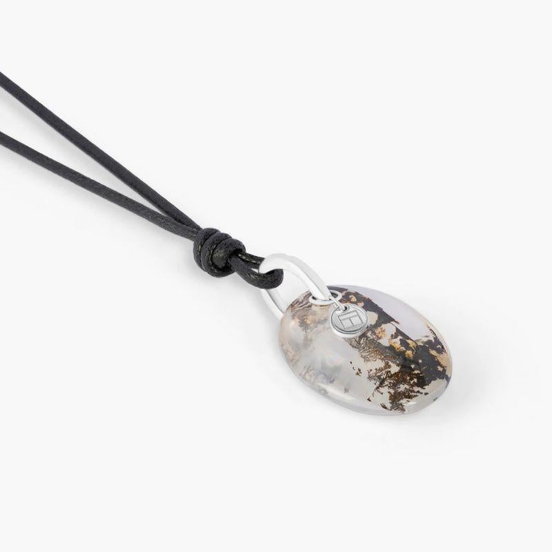 Dendritic Quartz (26.50ct) Necklace in 18k White Gold

A smooth oval Dendrite Quartz stone, sourced from Brazil, is captured on an 18k white gold loop allowing the raw and organic beauty of the stone to be admired from all angles. An eye-catching,
