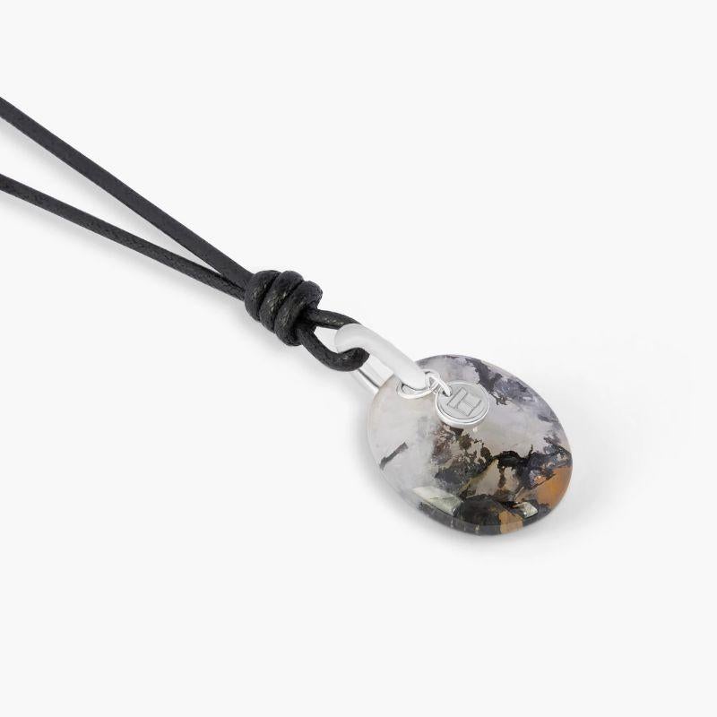 Dendritic Quartz (27.69ct) Necklace in 18k White Gold

A smooth oval Dendrite Quartz stone, sourced from Brazil, is captured on an 18k white gold loop allowing the raw and organic beauty of the stone to be admired from all angles. An eye-catching,
