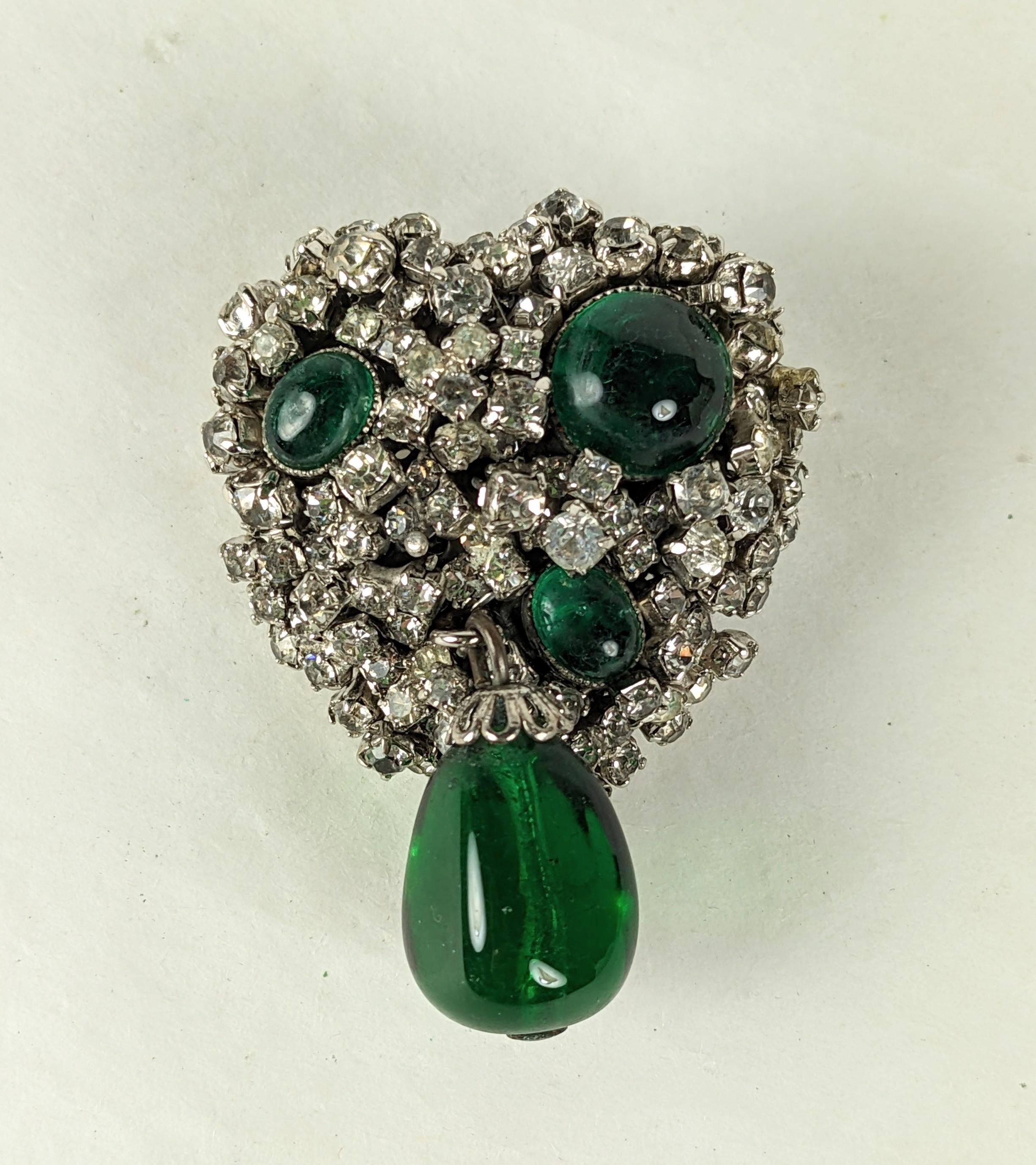 Charming DeNicola Gripoix and Paste Heart Brooch from the 1950's. Made in collaboration with Maison Gripoix in the 1950's, set in a backing of hand set pastes with emerald pate de verre drop.
1950's USA. 1.5